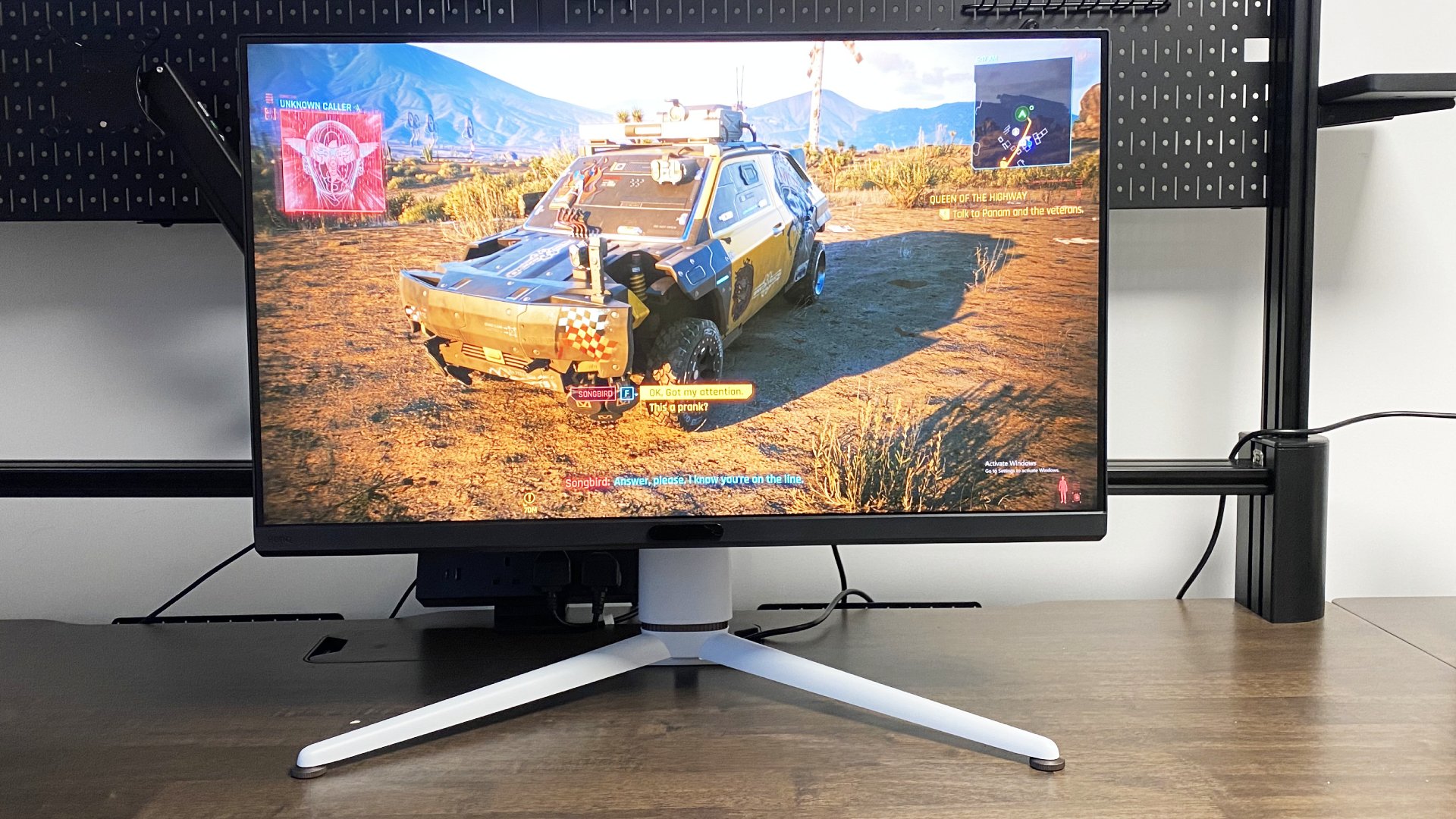 A photo of a BenQ MOBIUZ EX321UX gaming monitor