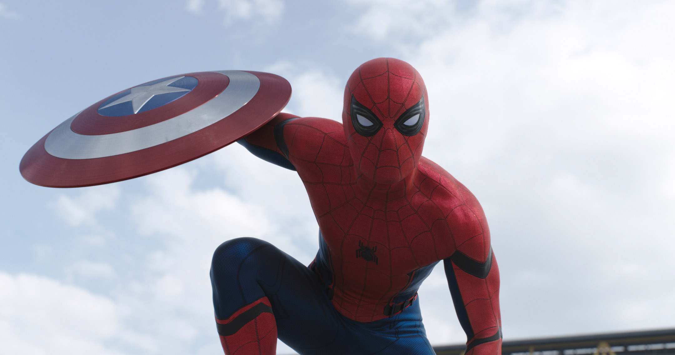 Spider-Man holding Captain America’s shield in Captain America: Civil War