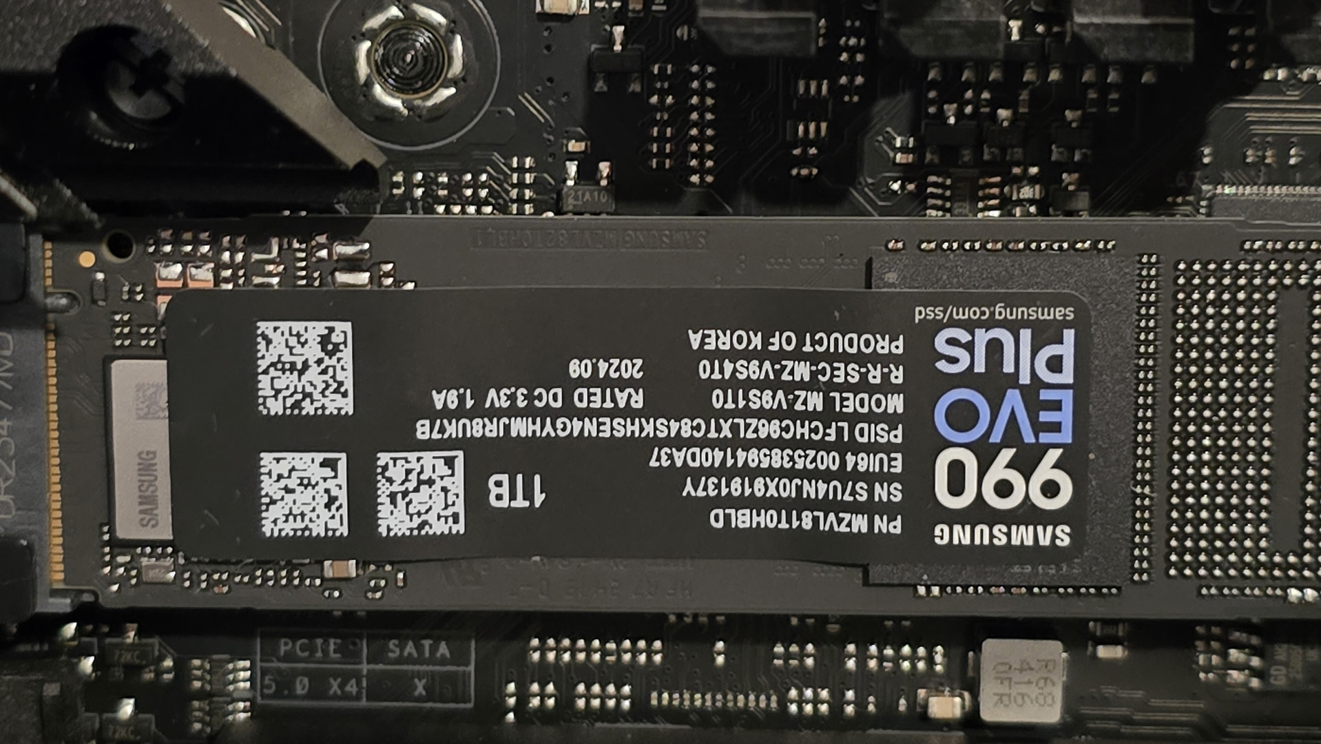 Samsung 990 Evo Plus installed inside a gaming PC's NVMe M.2 slot.