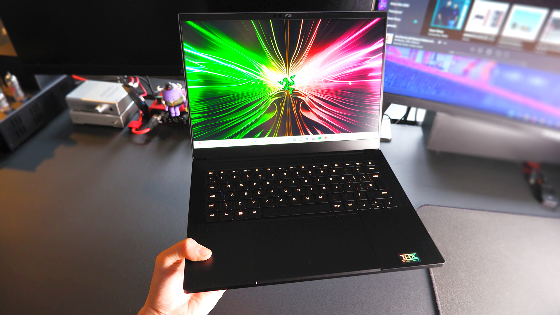 Razer Blade 14 gaming laptop on a desk.