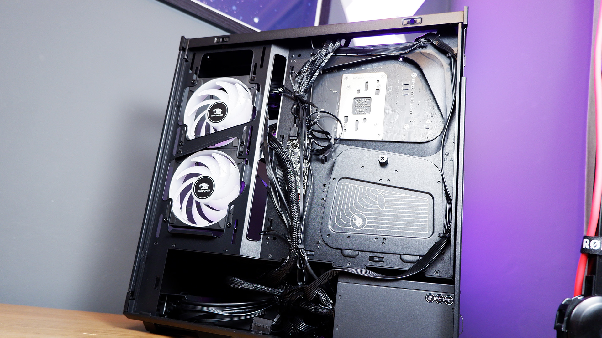 An iBuyPower gaming PC being set up on a desktop.