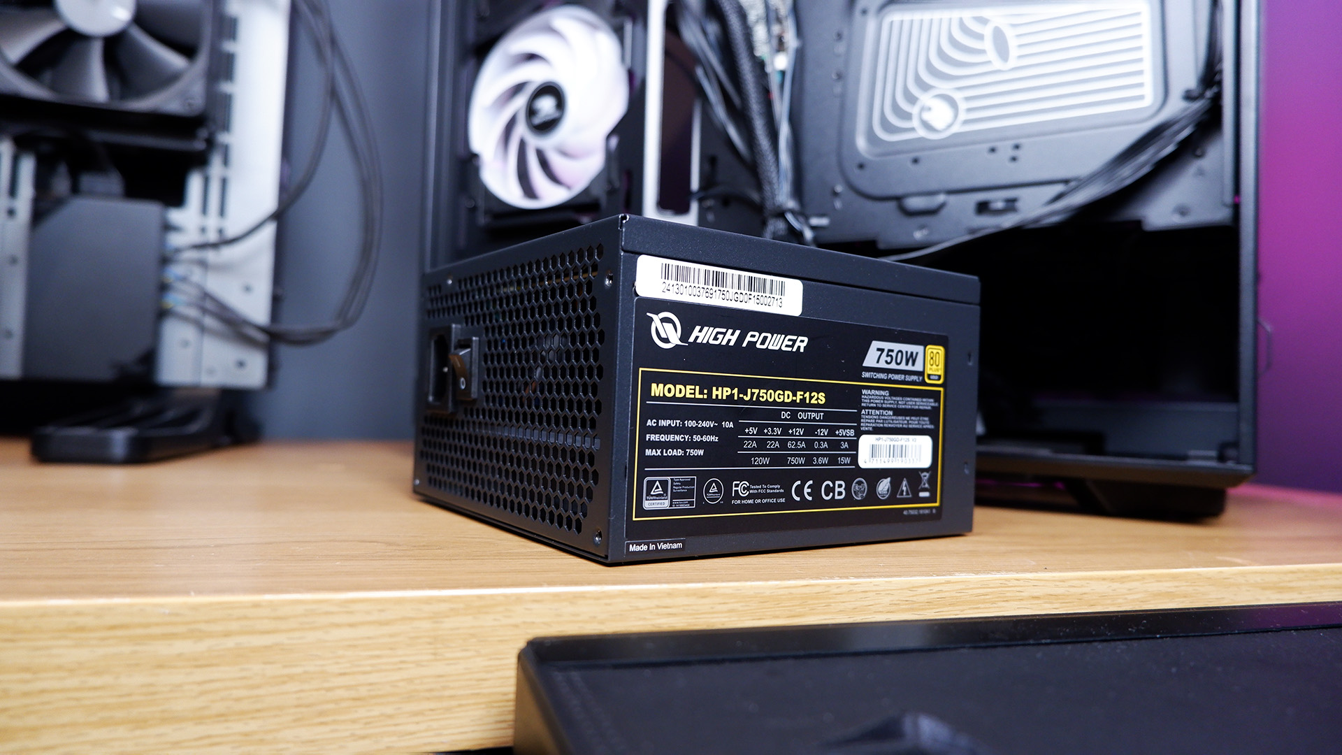 An iBuyPower gaming PC being set up on a desktop.