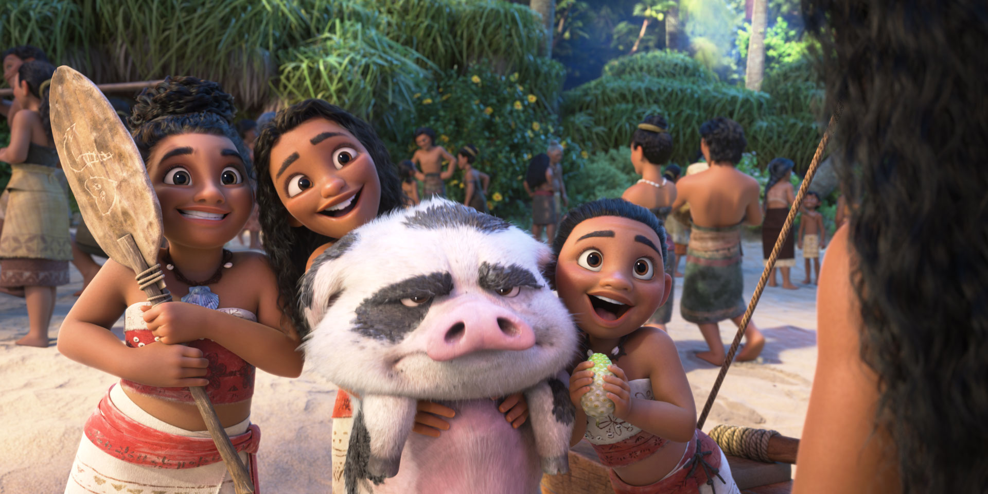 Three young girls from Moana’s tribe squee over her while squeezing a pig in Moana 2