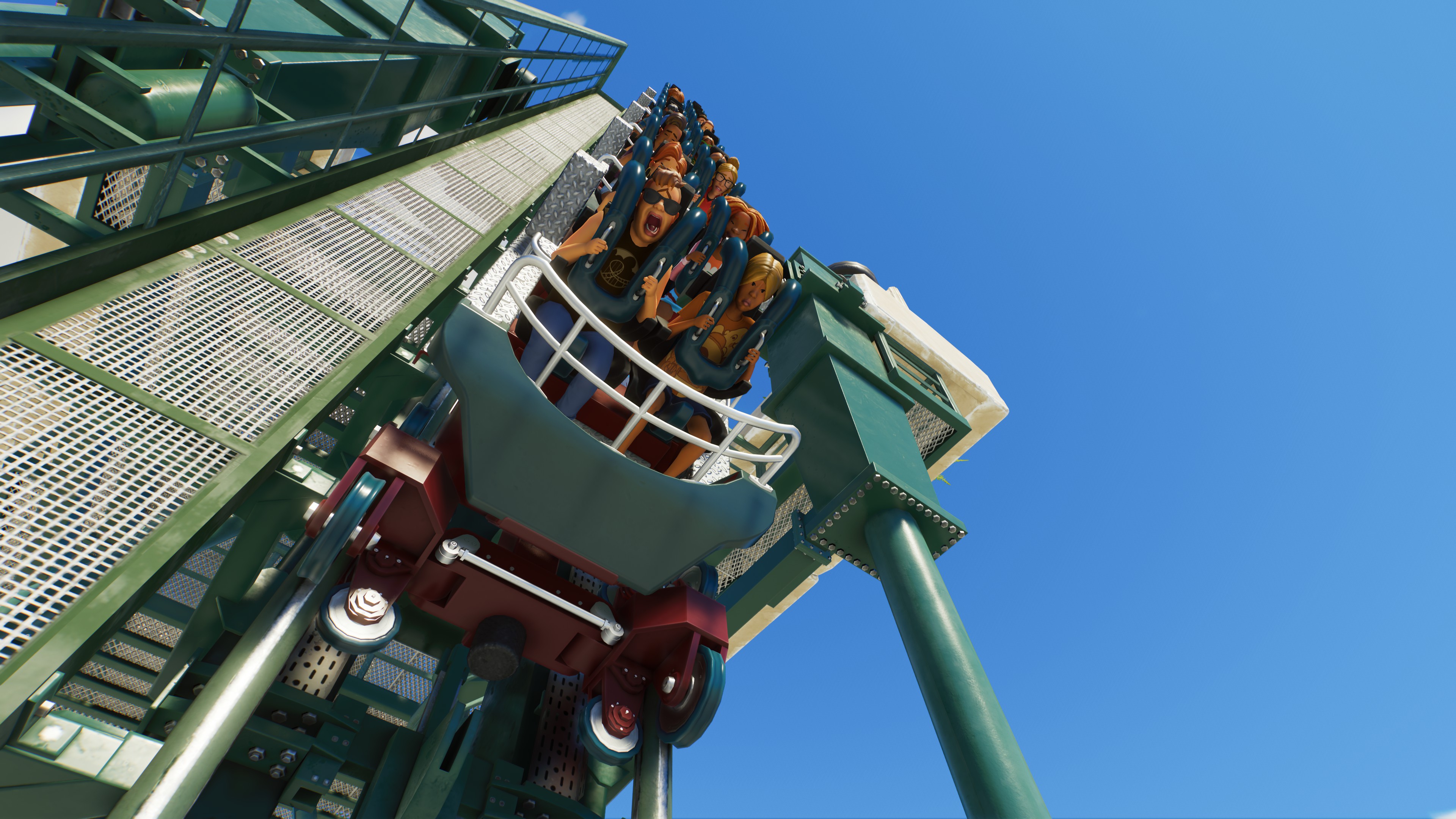 Riders scream as the roller coaster takes a steep plunge.