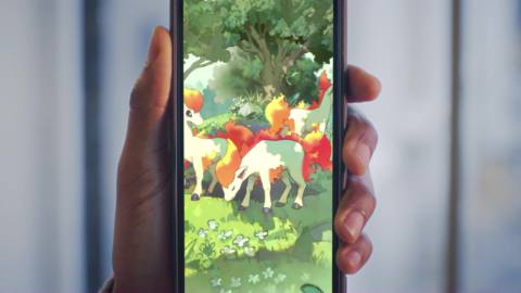 A close-up photo of a phone showing card art of Ponyta zoomed in, from Pokemon Trading Card Game Pocket.