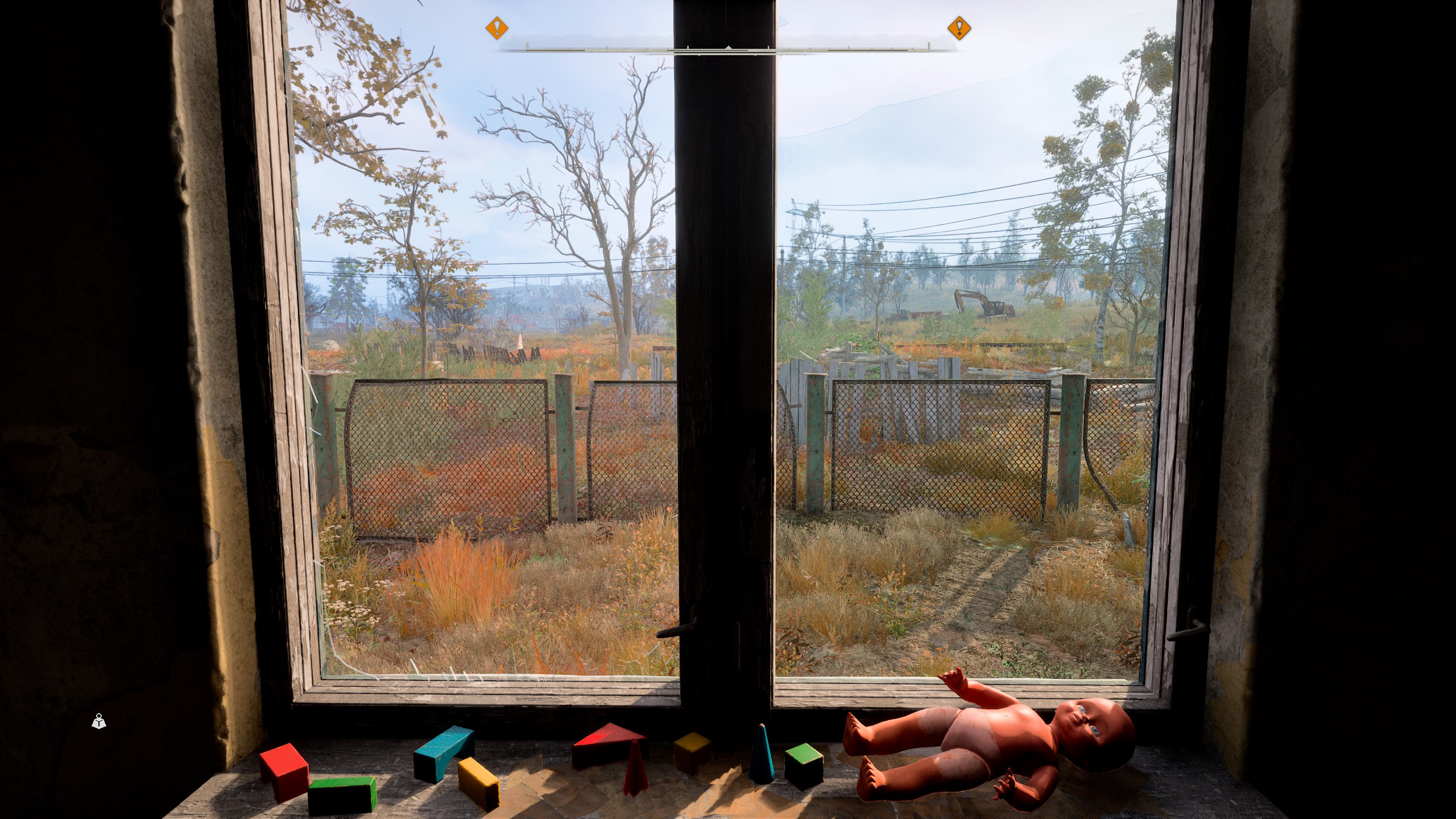 Looking out at the Zone through the window of a derelict building, discarded children's toys litter the sill.