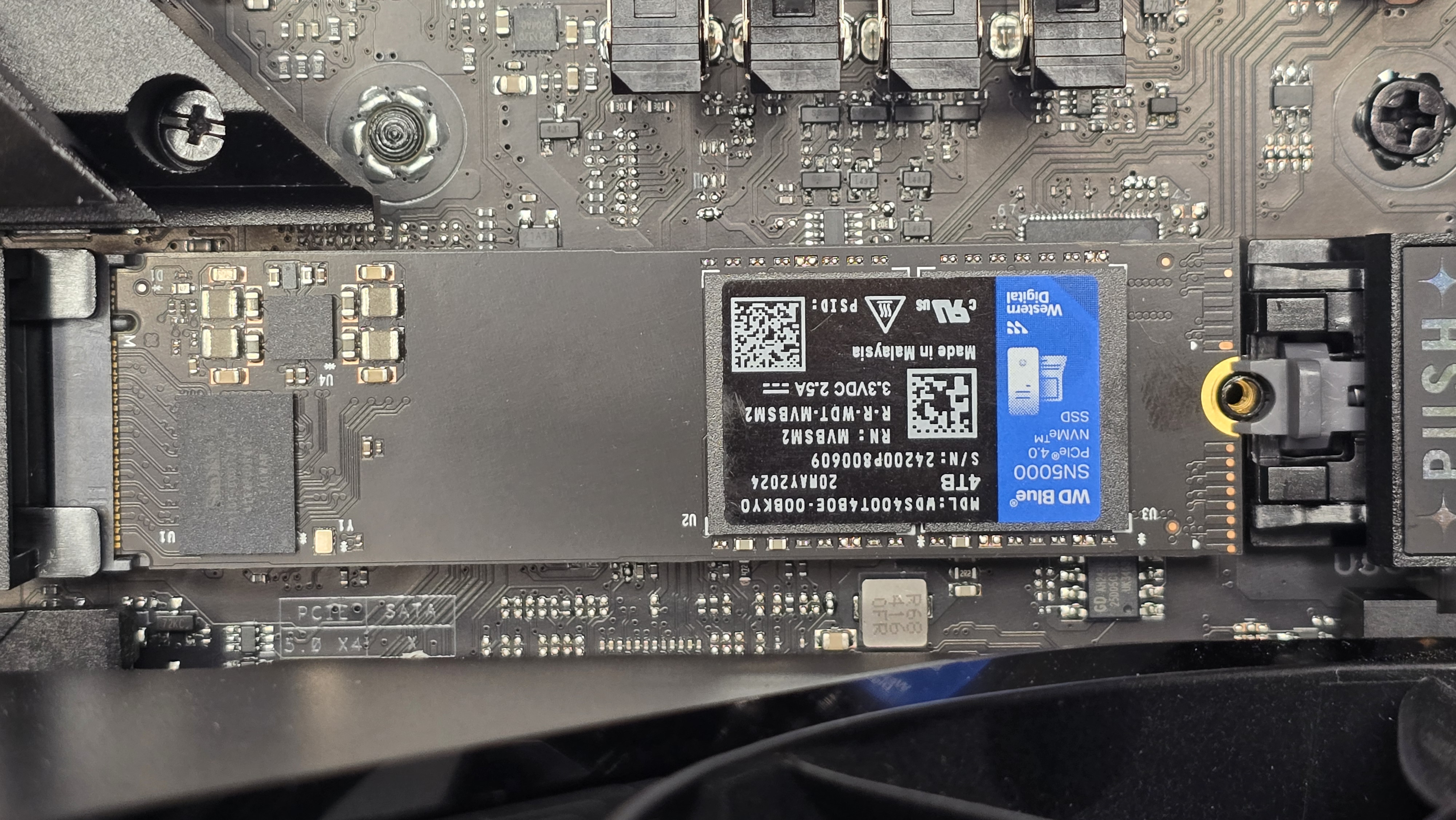 A WD SN5000 SSD out of its box and installed in a PC's NVMe slot.