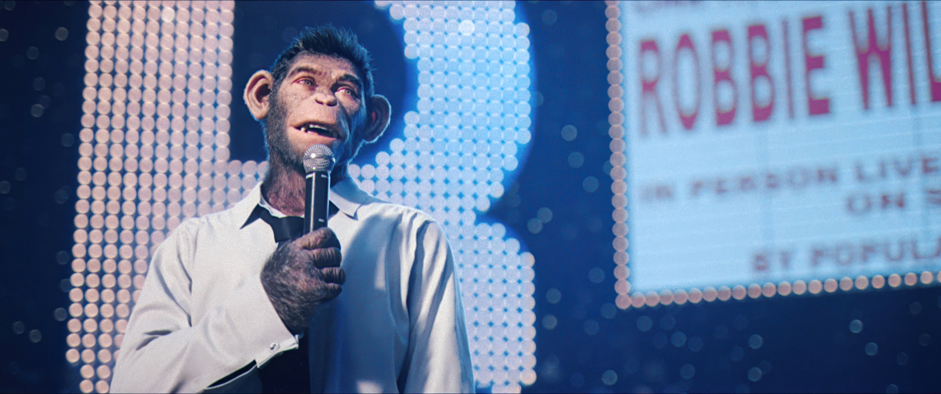 In Better Man, a monkey version of Robbie Williams holds a mic on stage