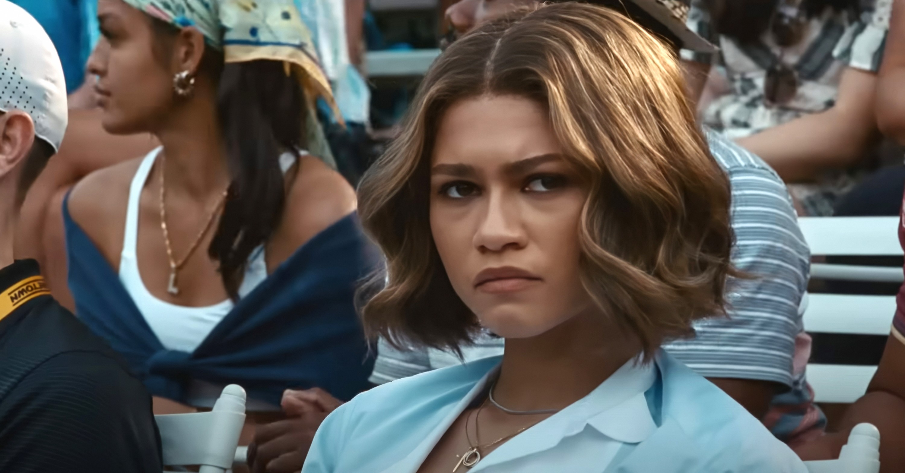 Tashi (Zendaya) looking serious in the stands at the final challengers match