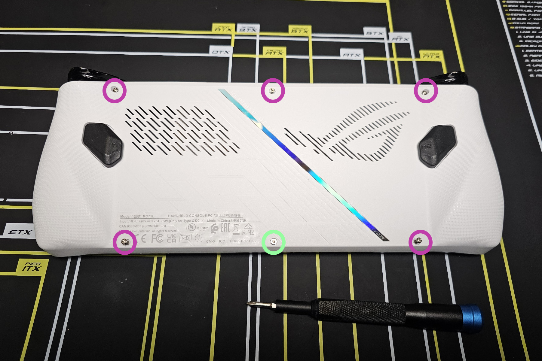 A photo of the back of an Asus ROG Ally with the six screws holding the back plate in place highlighted A photo of the back of an Asus ROG Ally with the six screws holding the back plate in place highlighted