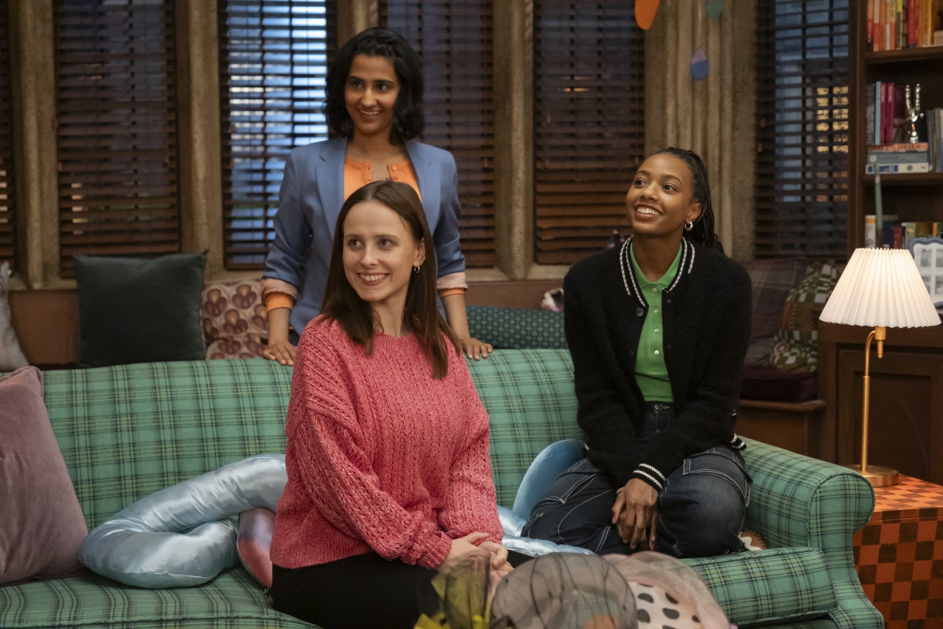 The main trio of Sex Lives of College Girls in a still from season 2, sitting on the couch and smiling at someone The main trio of Sex Lives of College Girls in a still from season 2, sitting on the couch and smiling at someone