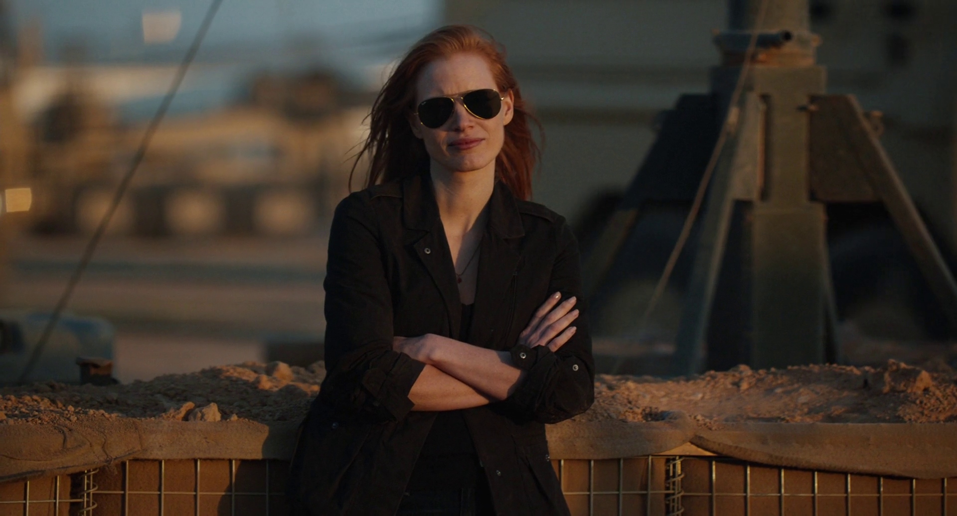 Jessica Chastain wearing sunglasses on a military base leaning against a wall in Zero Dark Thirty Jessica Chastain wearing sunglasses on a military base leaning against a wall in Zero Dark Thirty