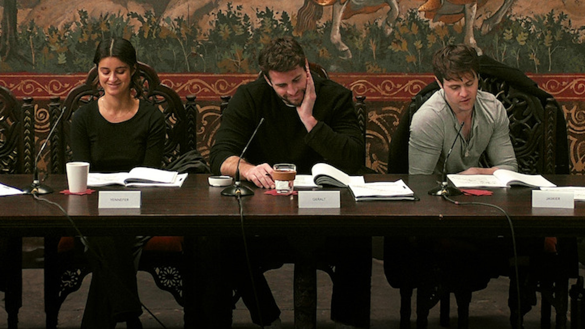 The Witcher season 4 promo image - Anya Chalotra, Liam Hemsworth, and Joey Batey in a season 4 script reading session