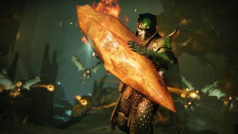 A Guardian carries a flaming crystal in Destiny 2