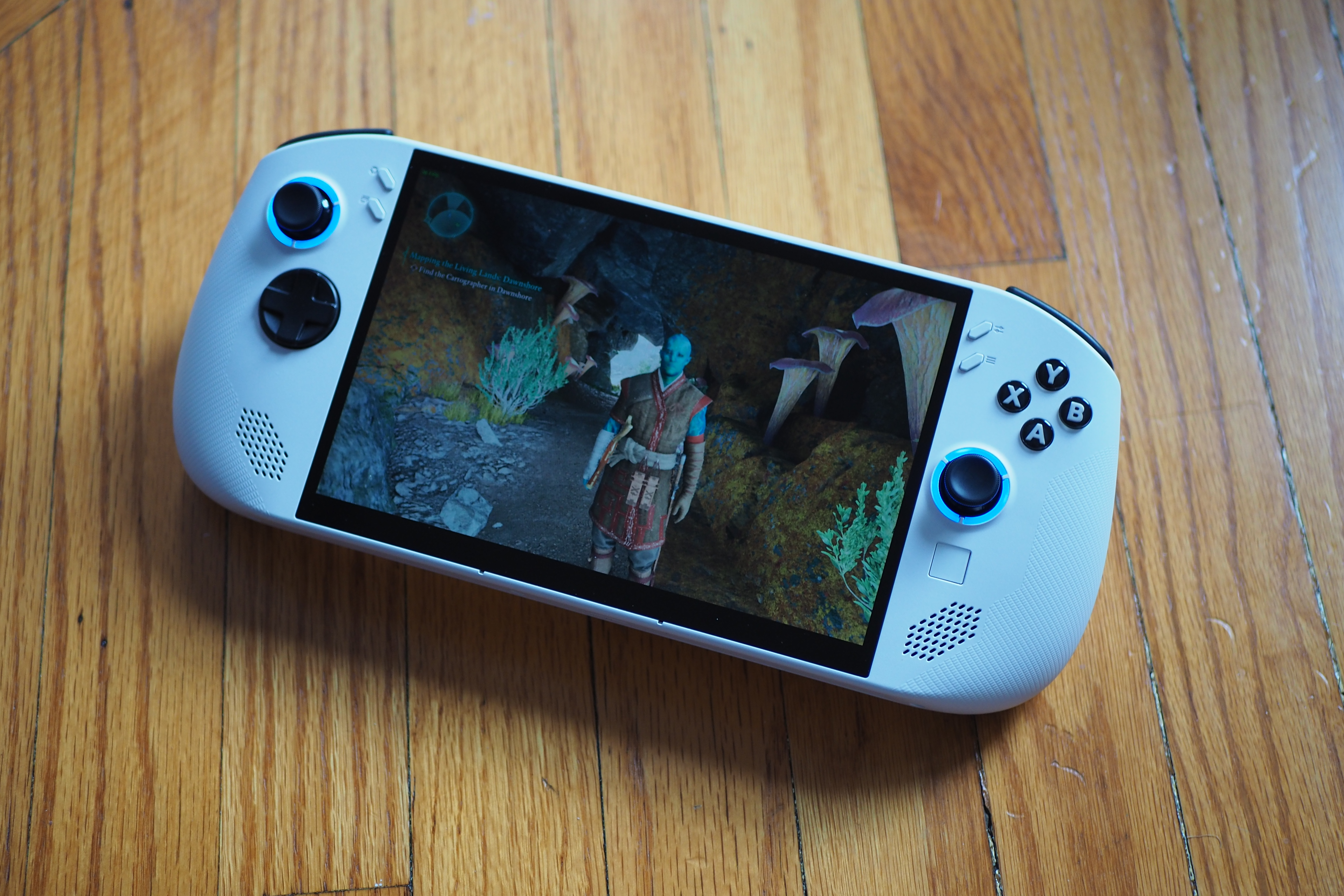 A photo showing off Avowed running on the Lenovo Legion Go S, which is sitting on a wooden surface. A photo showing off Avowed running on the Lenovo Legion Go S, which is sitting on a wooden surface.