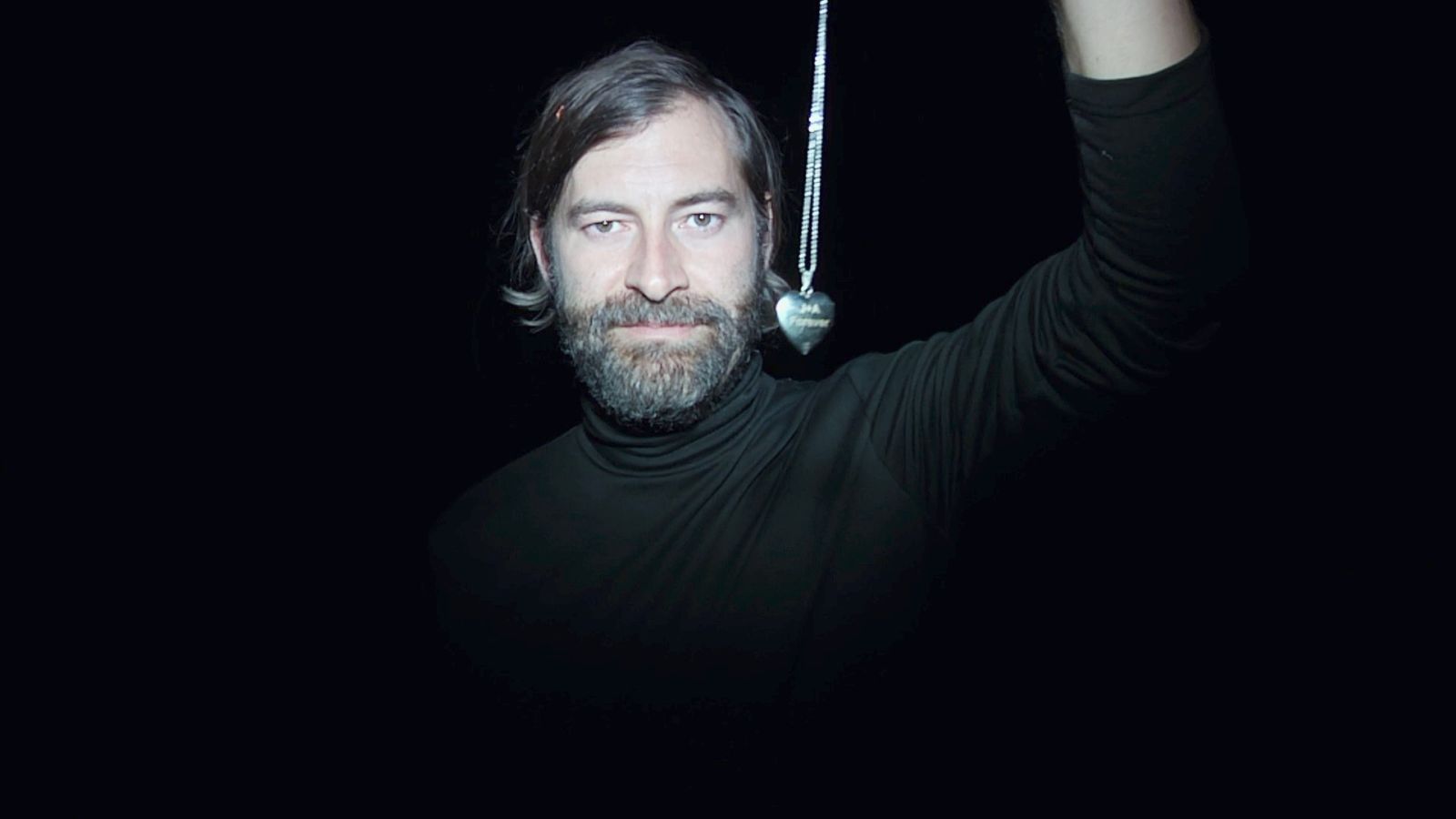 Creep 2 - Mark Duplass holds a necklace