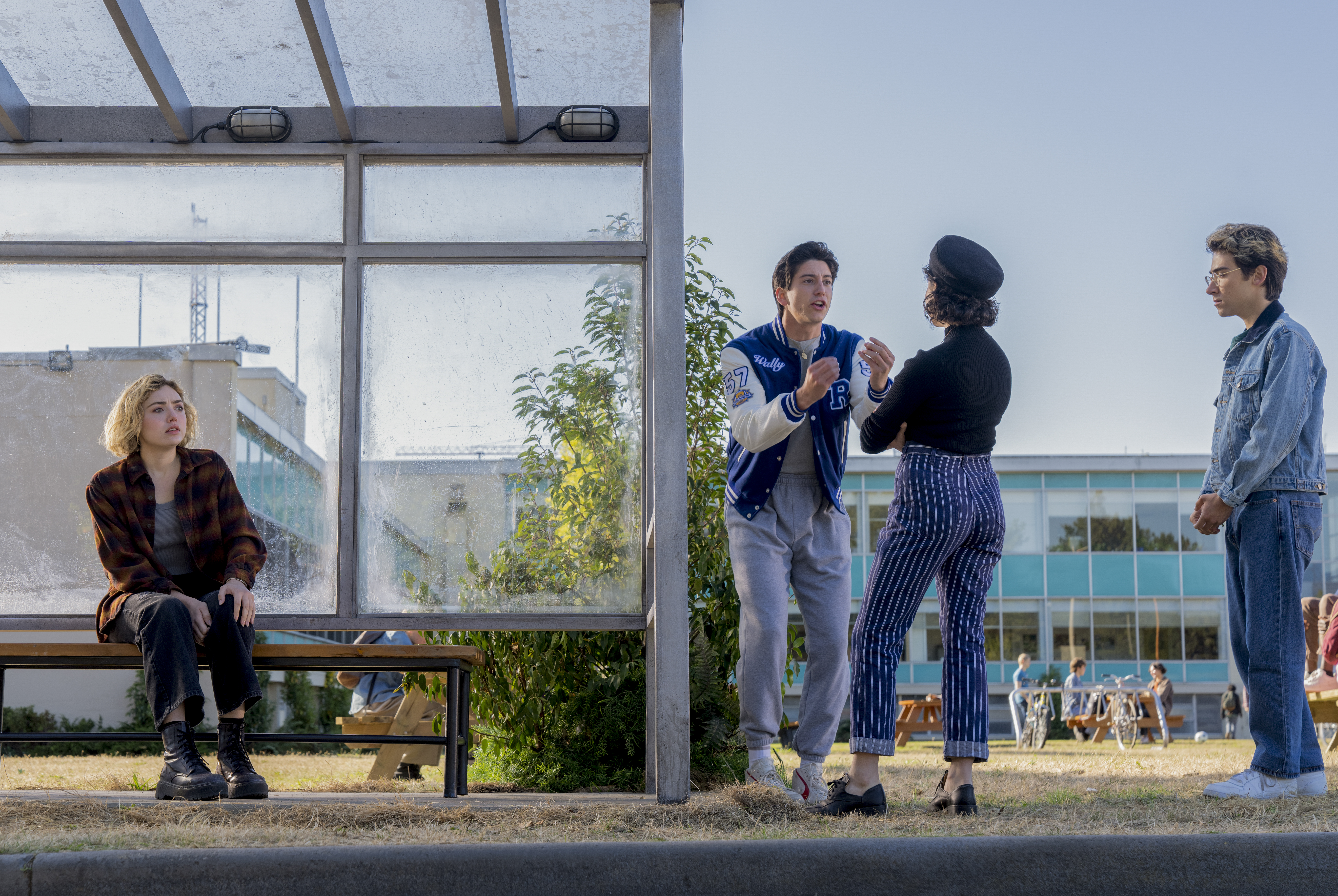 Maddie (Peyton List) sitting at a bus stop while fellow ghosts argue with each other) Maddie (Peyton List) sitting at a bus stop while fellow ghosts argue with each other)