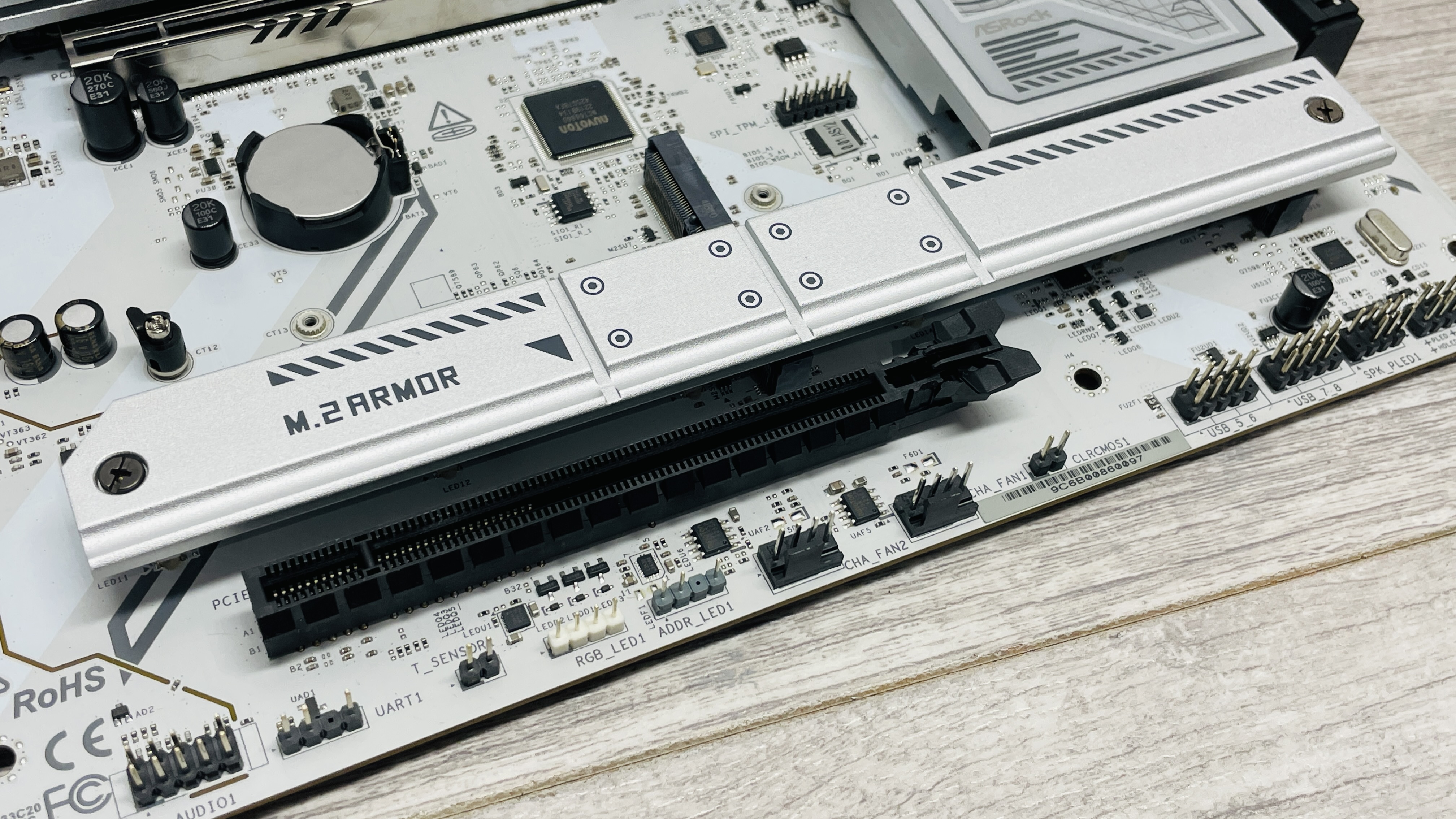 ASRock B850 Steel Legend Wi-Fi motherboard on a desk.