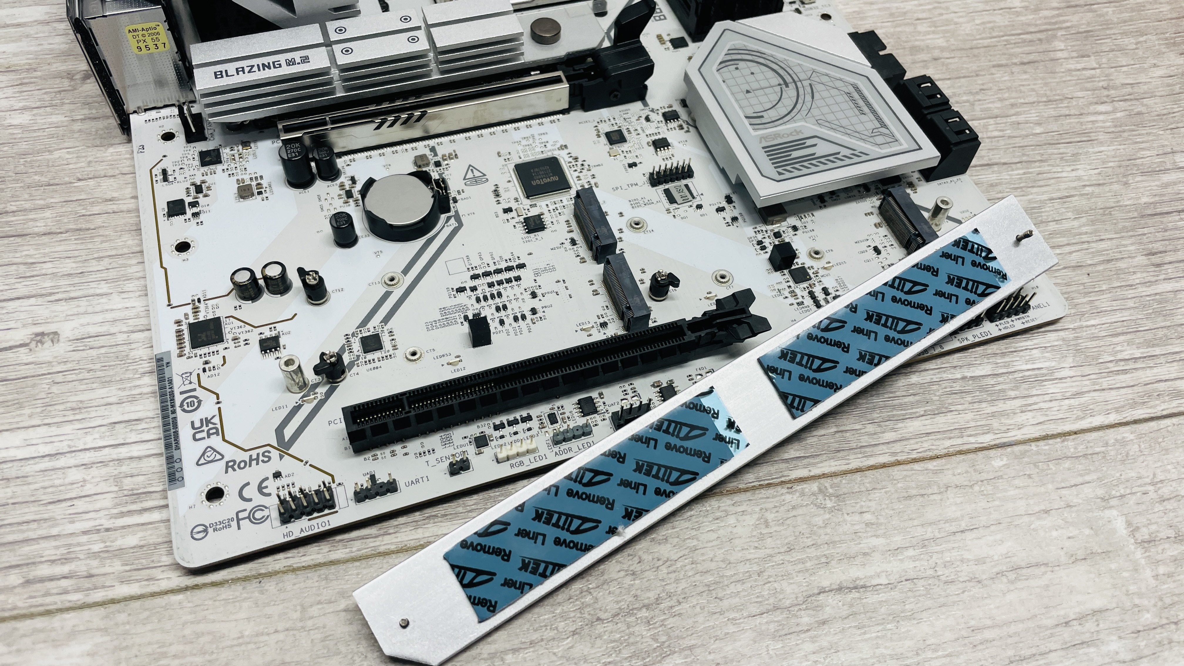 ASRock B850 Steel Legend Wi-Fi motherboard on a desk.