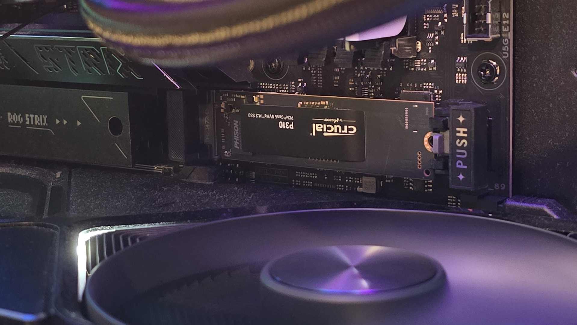 A Crucial P310 SSD installed inside a gaming PC.