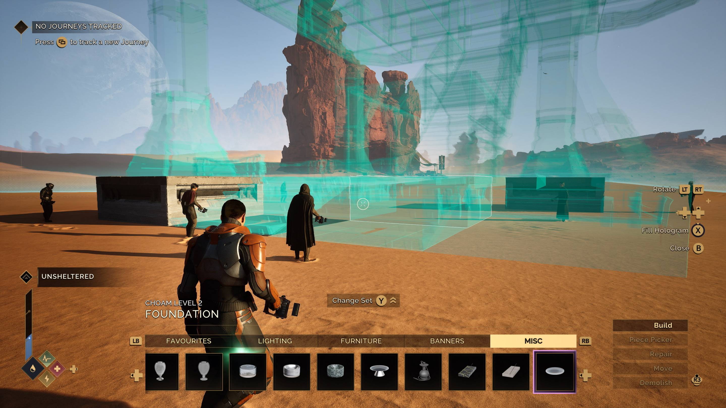 Players building a base in Dune Awakening