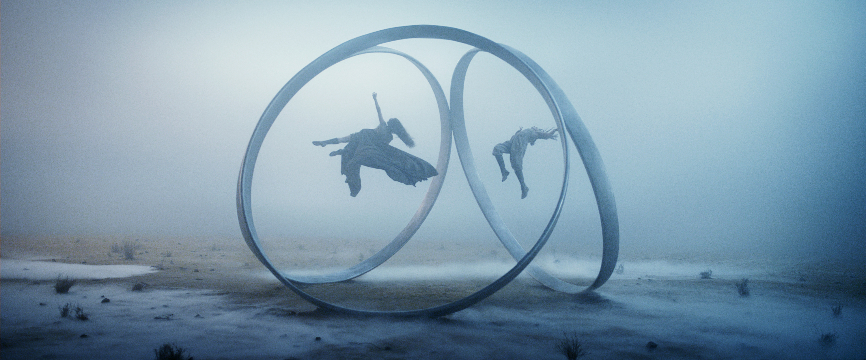 Rosamund Pike (as Moiraine) and Ayoola Smart ( as Aviendha) being suspended in portal rings in a still from Wheel of Time season 3 Rosamund Pike (as Moiraine) and Ayoola Smart ( as Aviendha) being suspended in portal rings in a still from Wheel of Time season 3