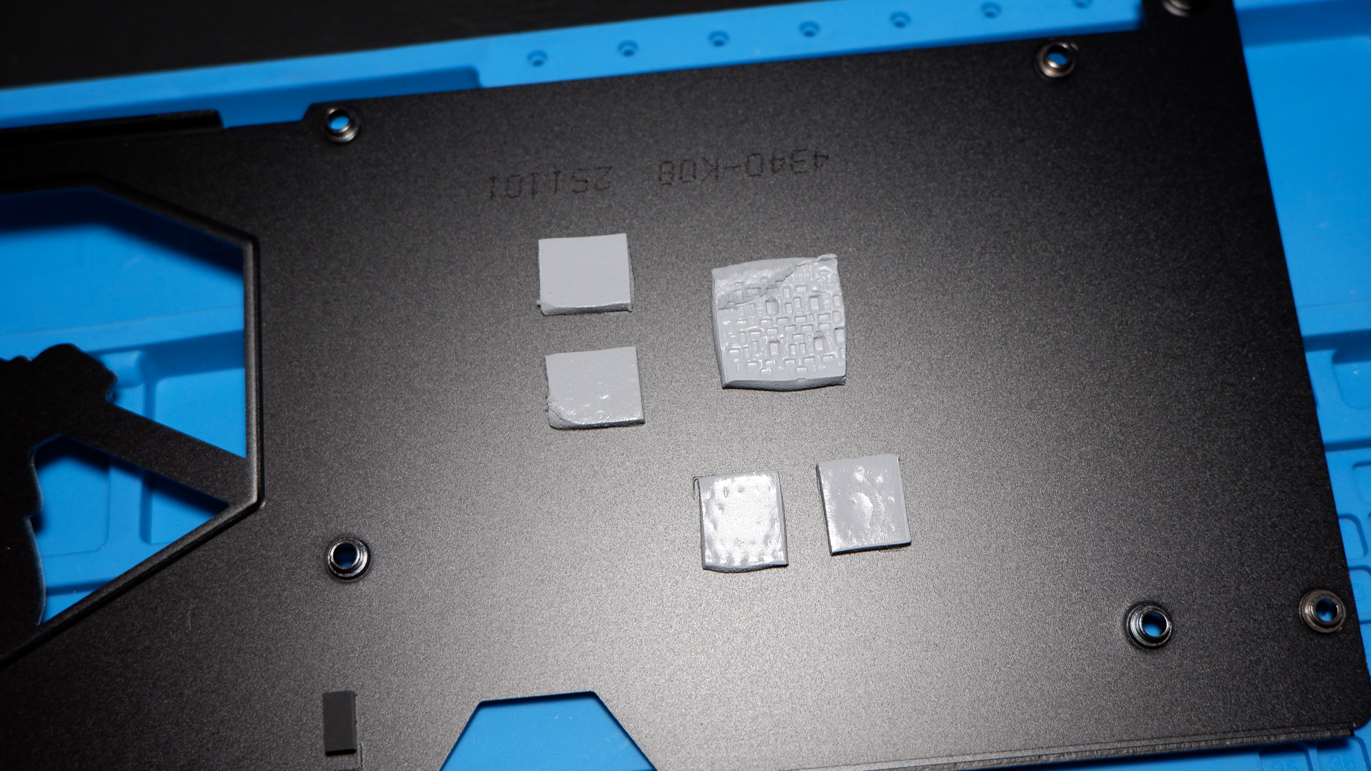 An MSI RTX 5060 Ti on top of a PC case and with the rear backplate removed.