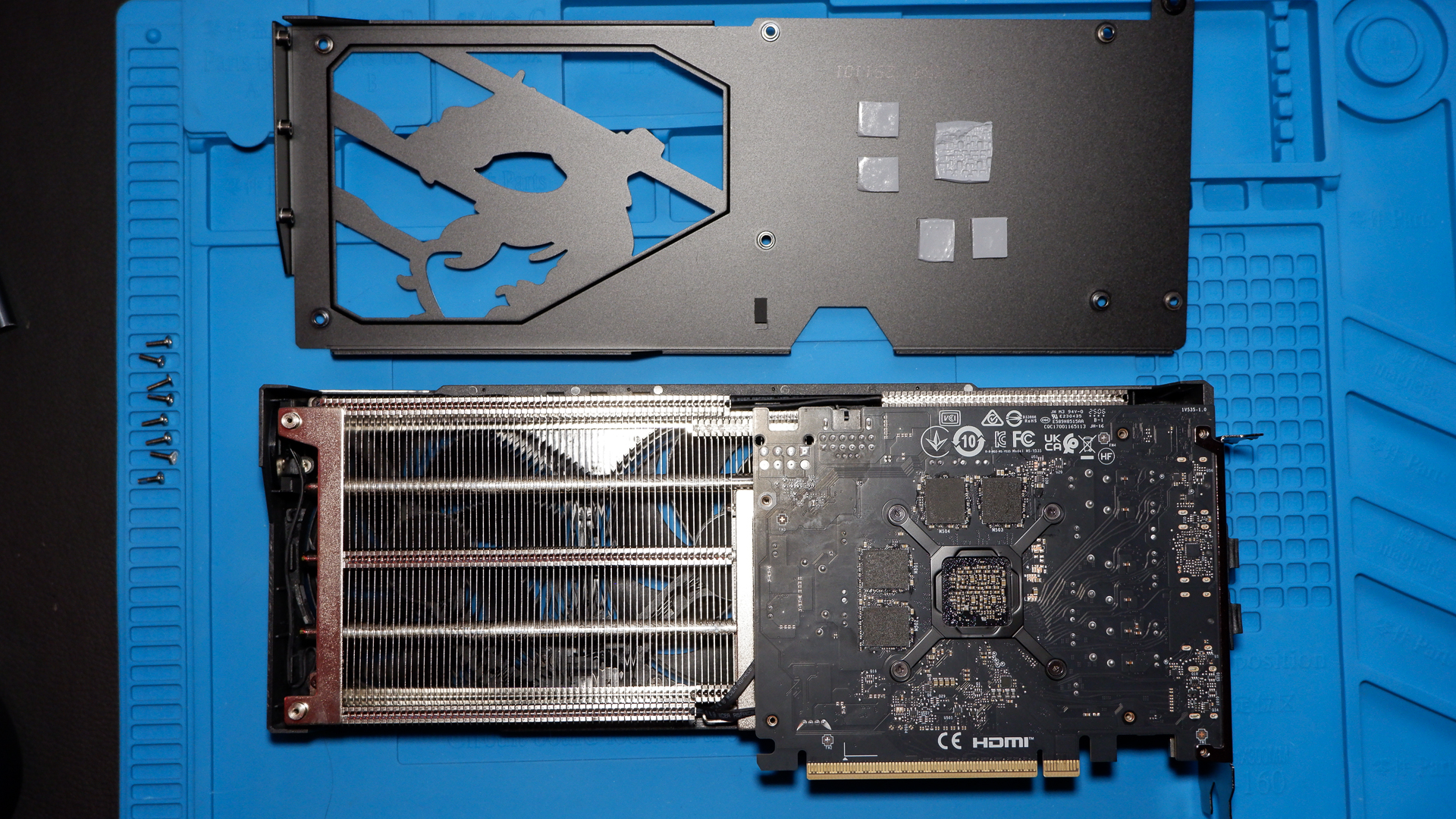 An MSI RTX 5060 Ti on top of a PC case and with the rear backplate removed.