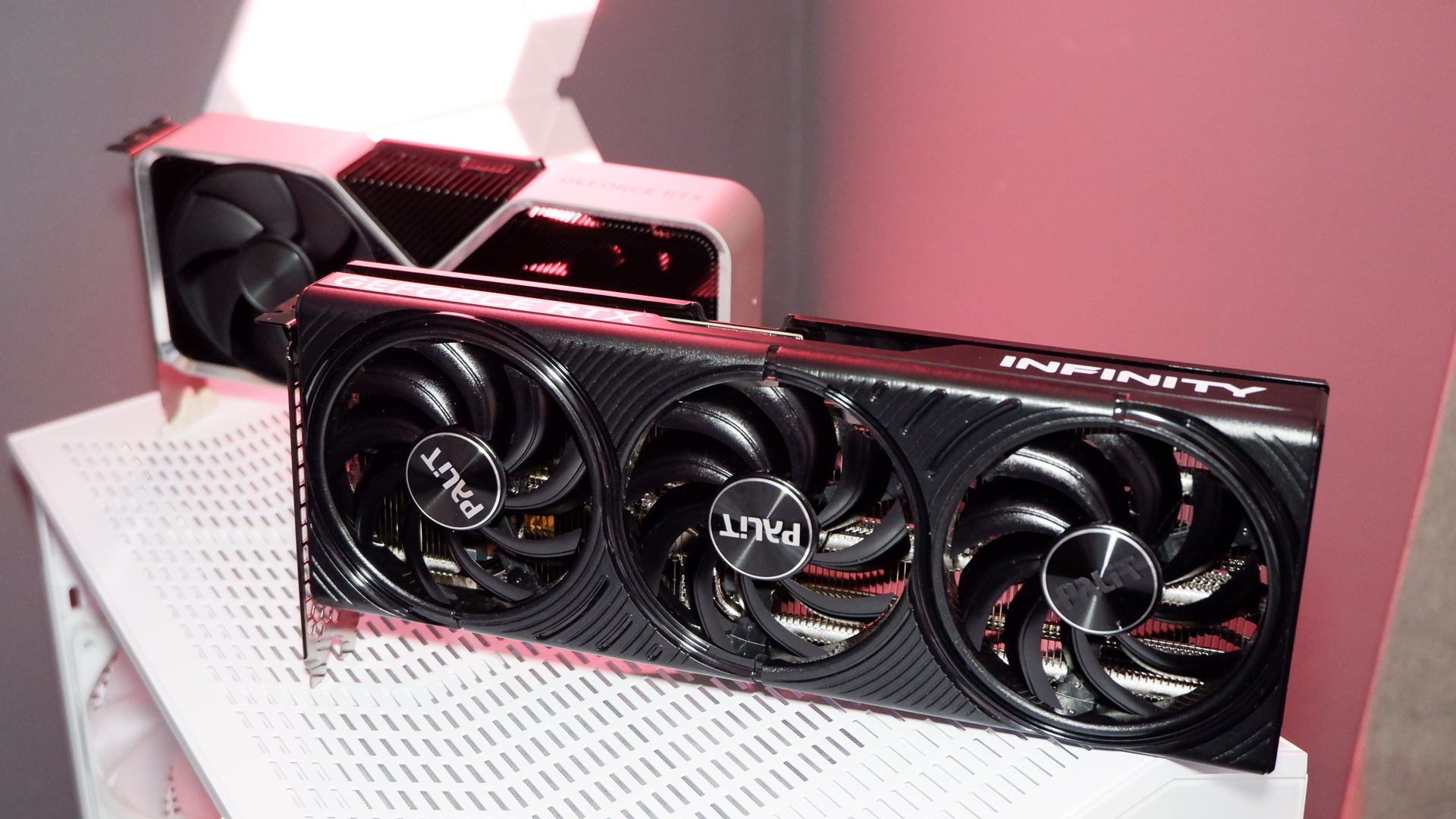 Two RTX 5060 Ti graphics cards lined up next to an RTX 4060 Ti.