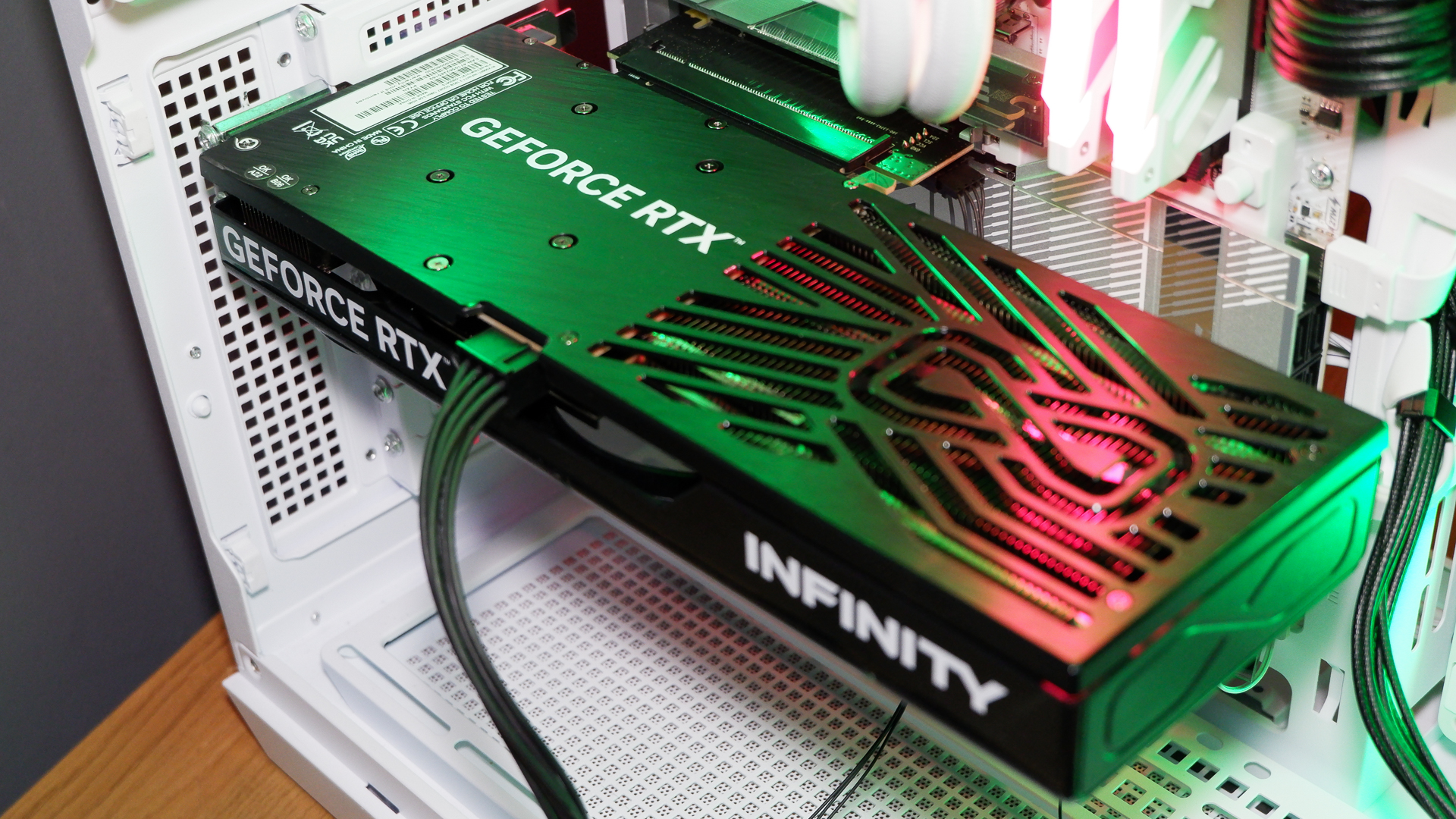 A Palit RTX 5060 Ti Infinity 3 with three fans and 16 GB of memory on a computer.