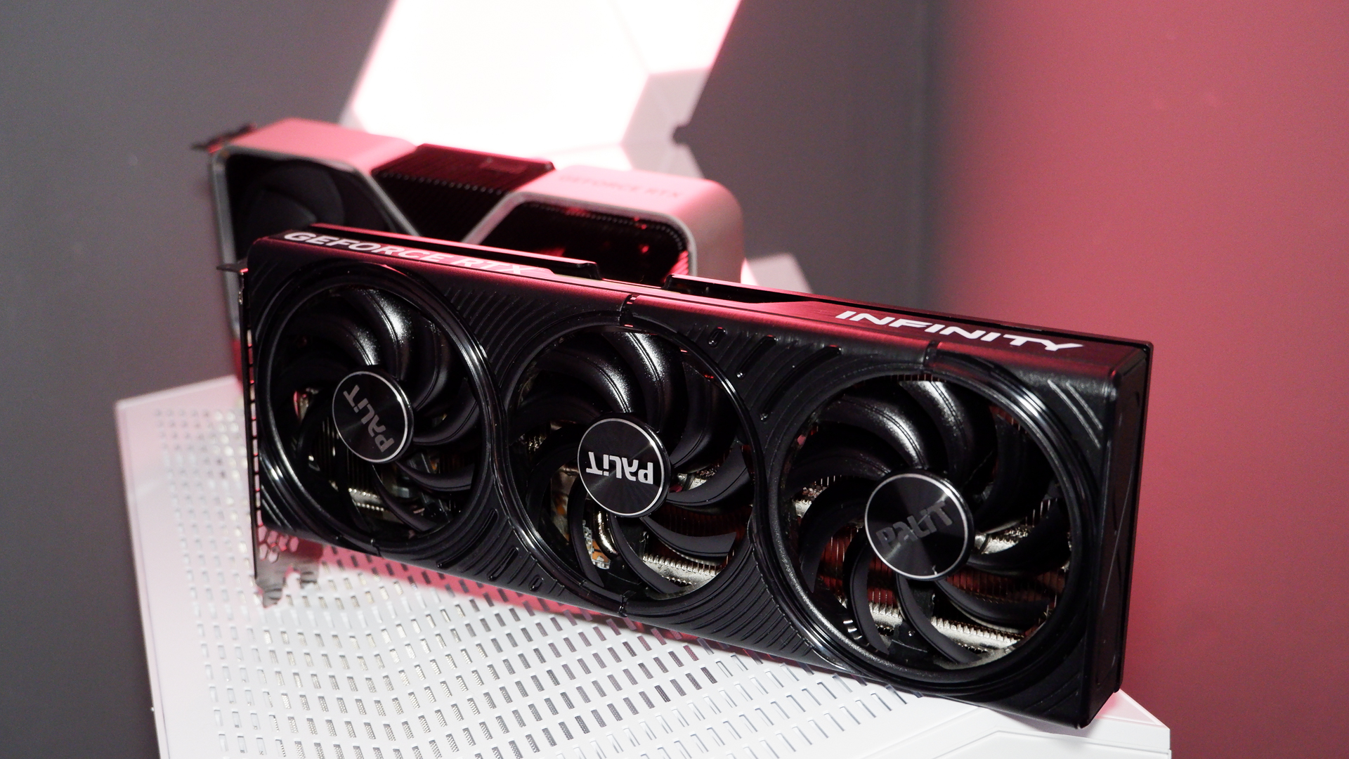 Two RTX 5060 Ti graphics cards lined up next to an RTX 4060 Ti.