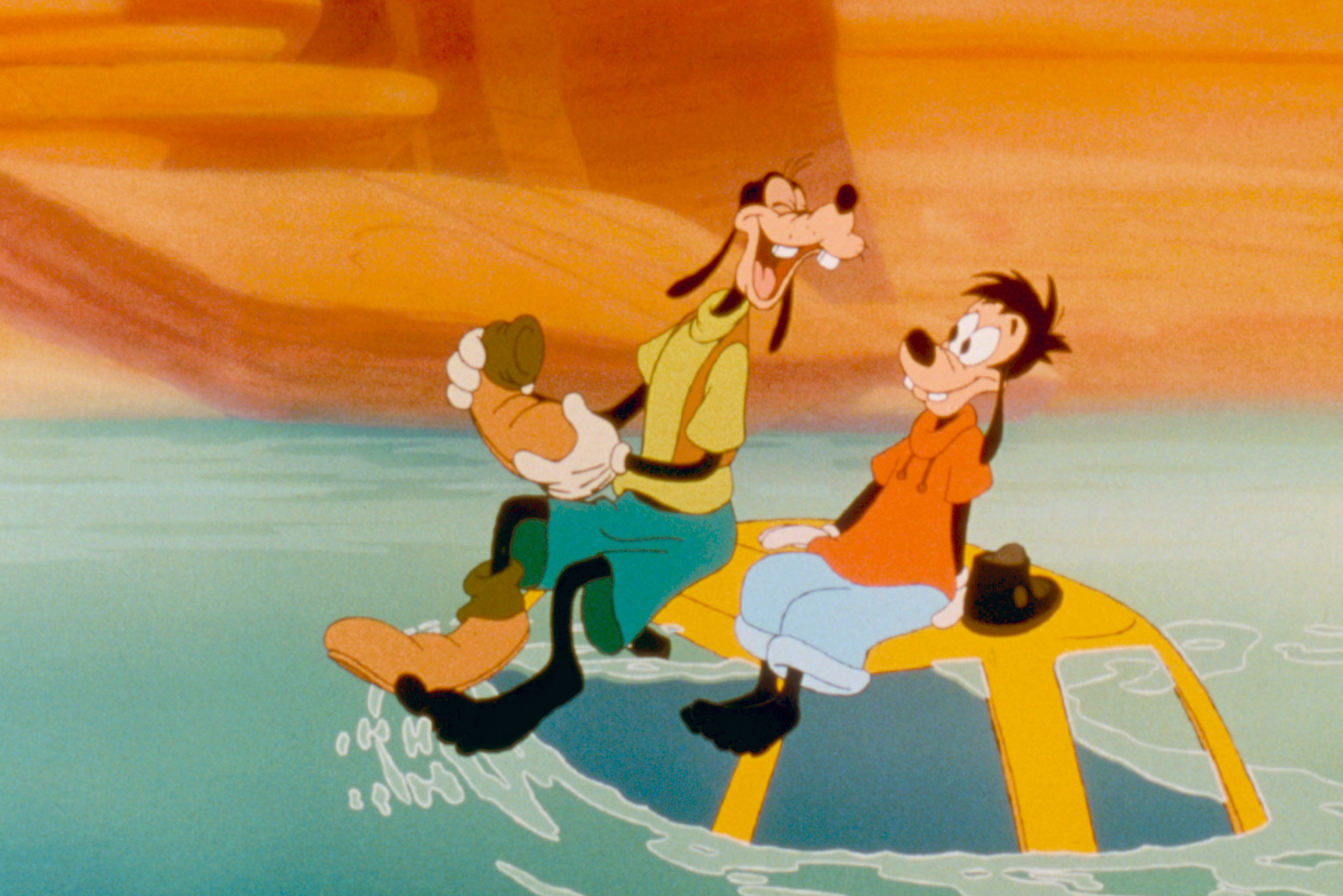 Goofy and Max sitting on their car as it floats down a river in a canyon. From A Goofy Movie