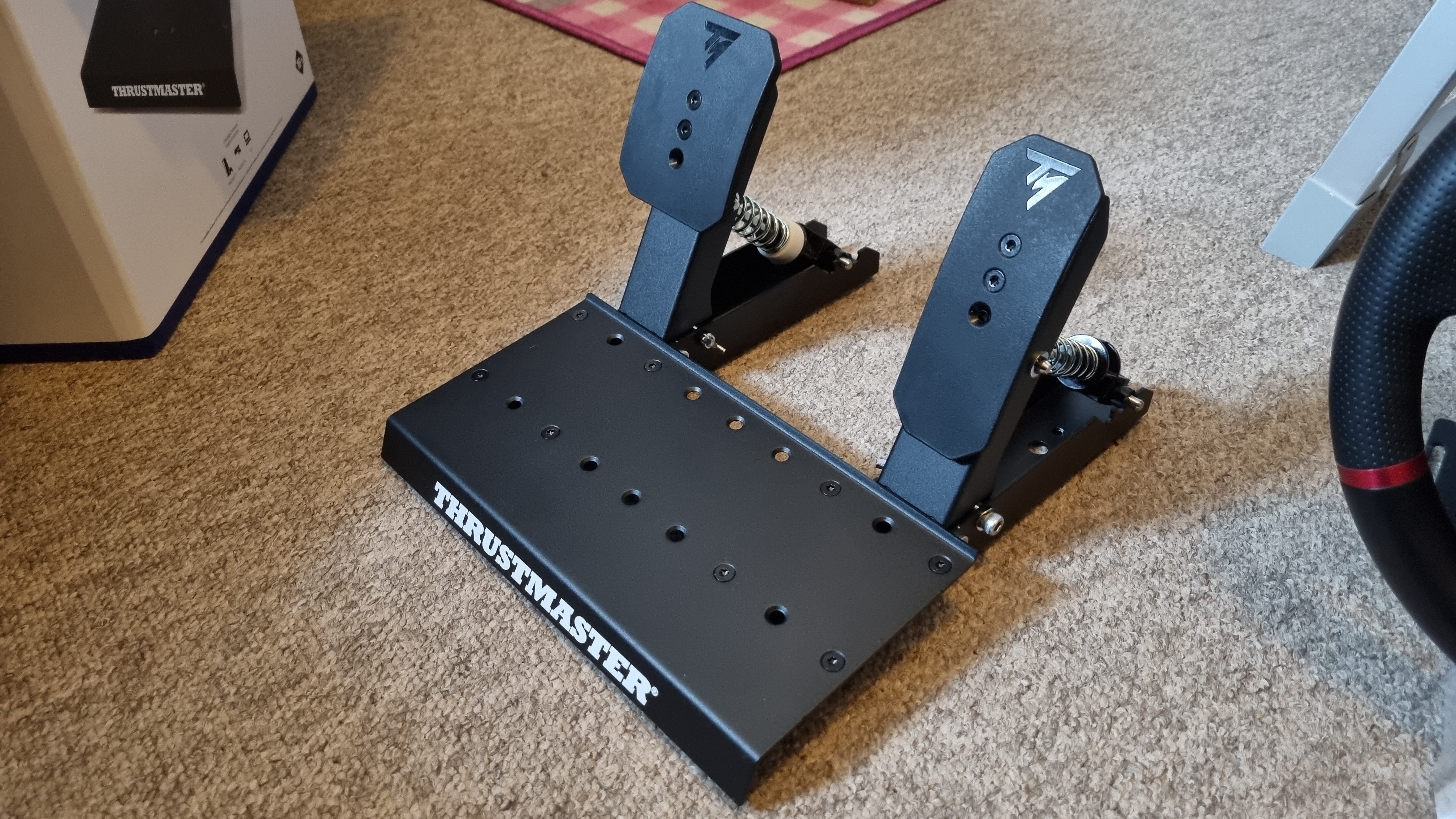 The Thrustmaster T598 pedals on carpet