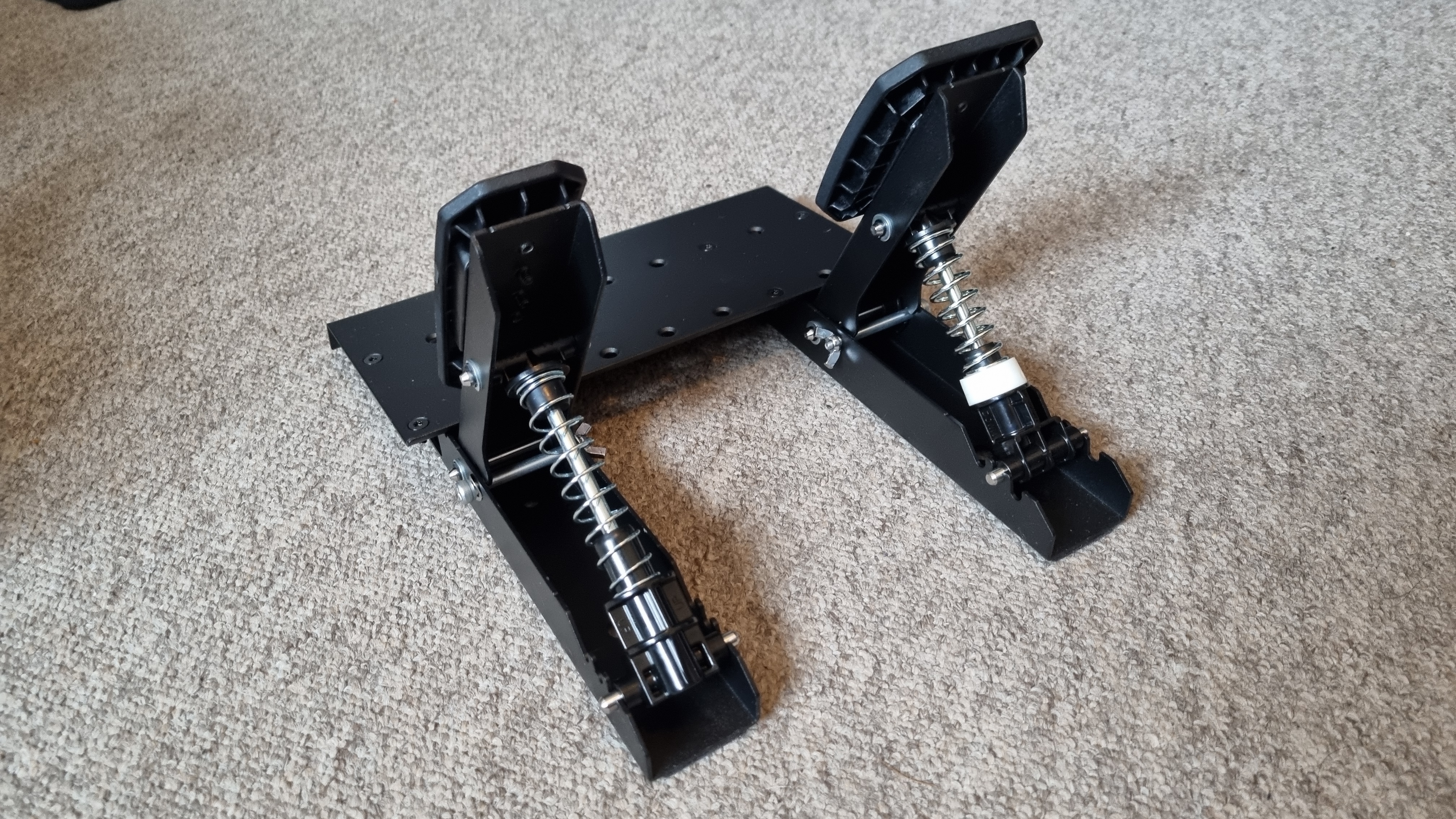 The Thrustmaster T598 pedals on carpet