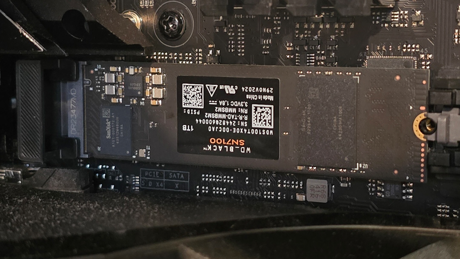 A WD Black SN7100 SSD installed inside a gaming PC.