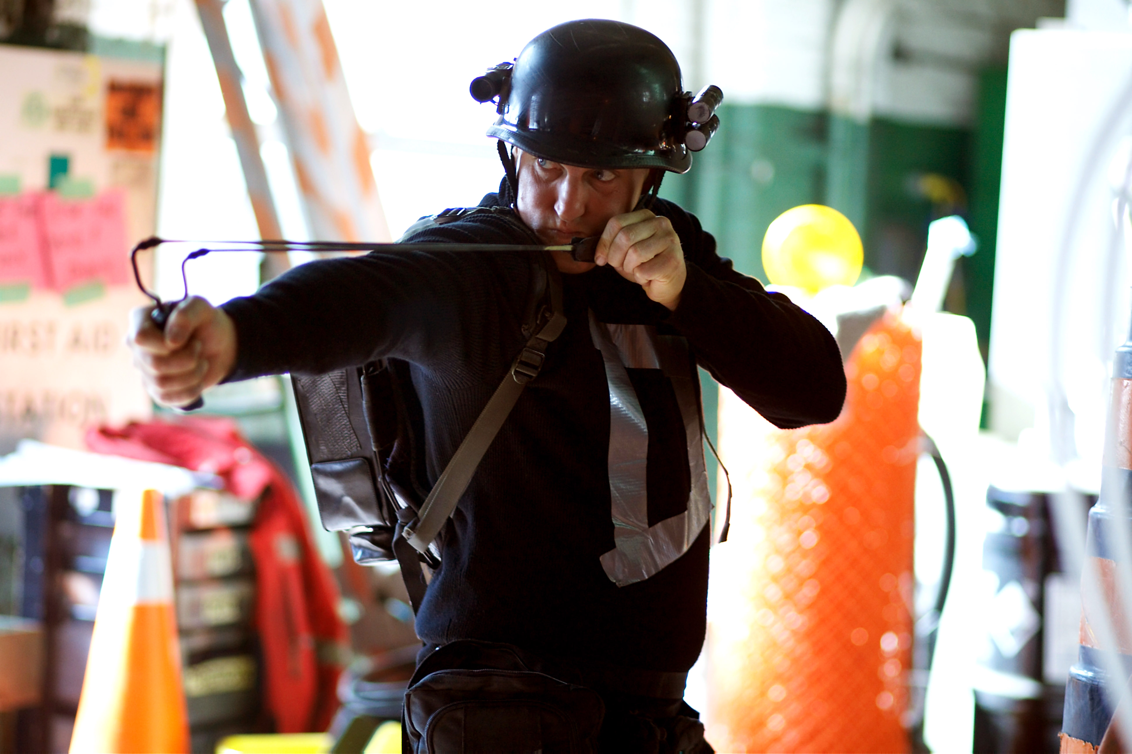 Woody Harrelson, wearing a goofy-looking helmet, readies a slingshot as the vigilante Defendor in Defendor Woody Harrelson, wearing a goofy-looking helmet, readies a slingshot as the vigilante Defendor in Defendor