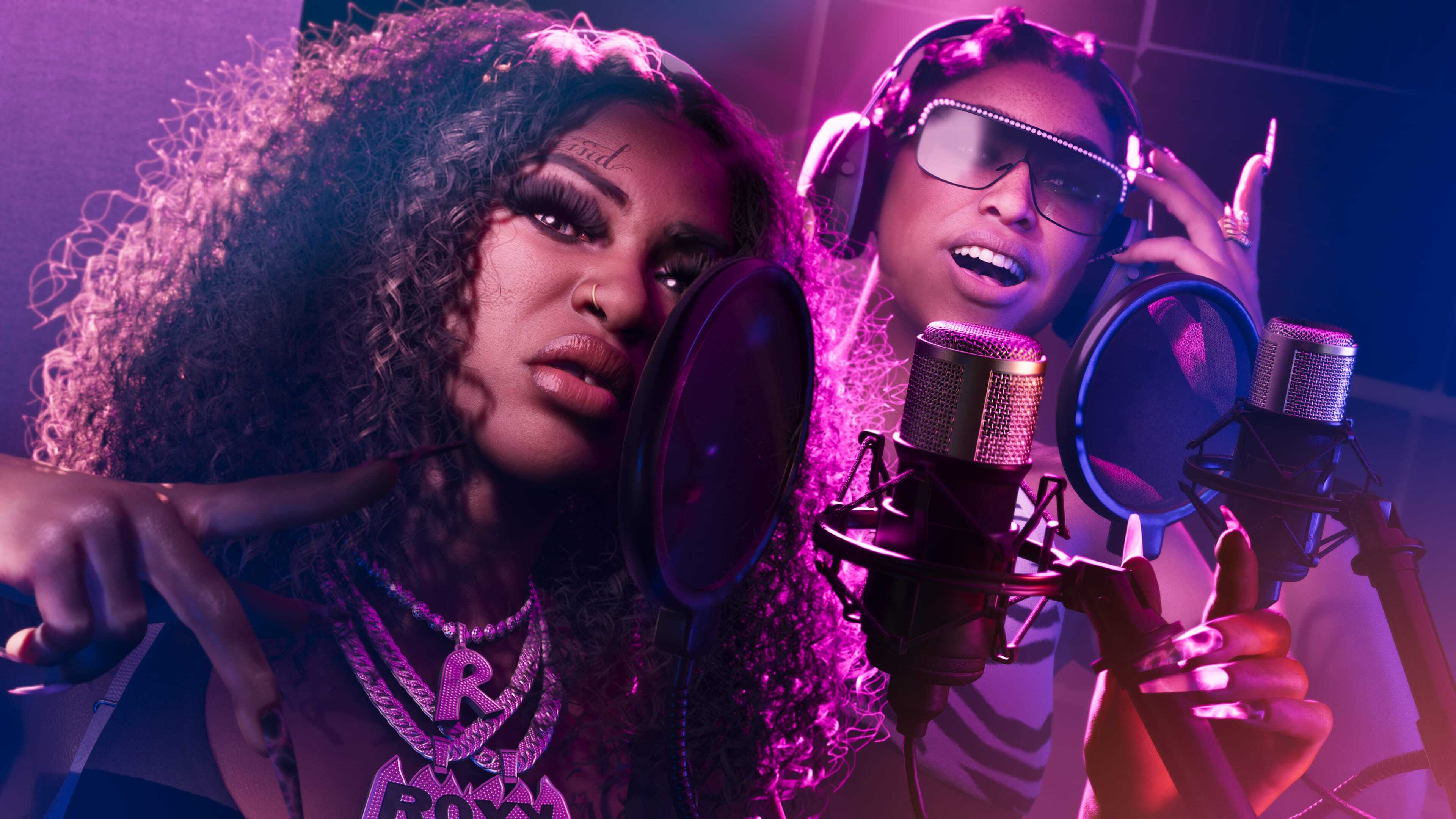 The two female members of Real Dimez, an R&B group in GTA 6, singing into two microphones in a recording studio together The two female members of Real Dimez, an R&B group in GTA 6, singing into two microphones in a recording studio together