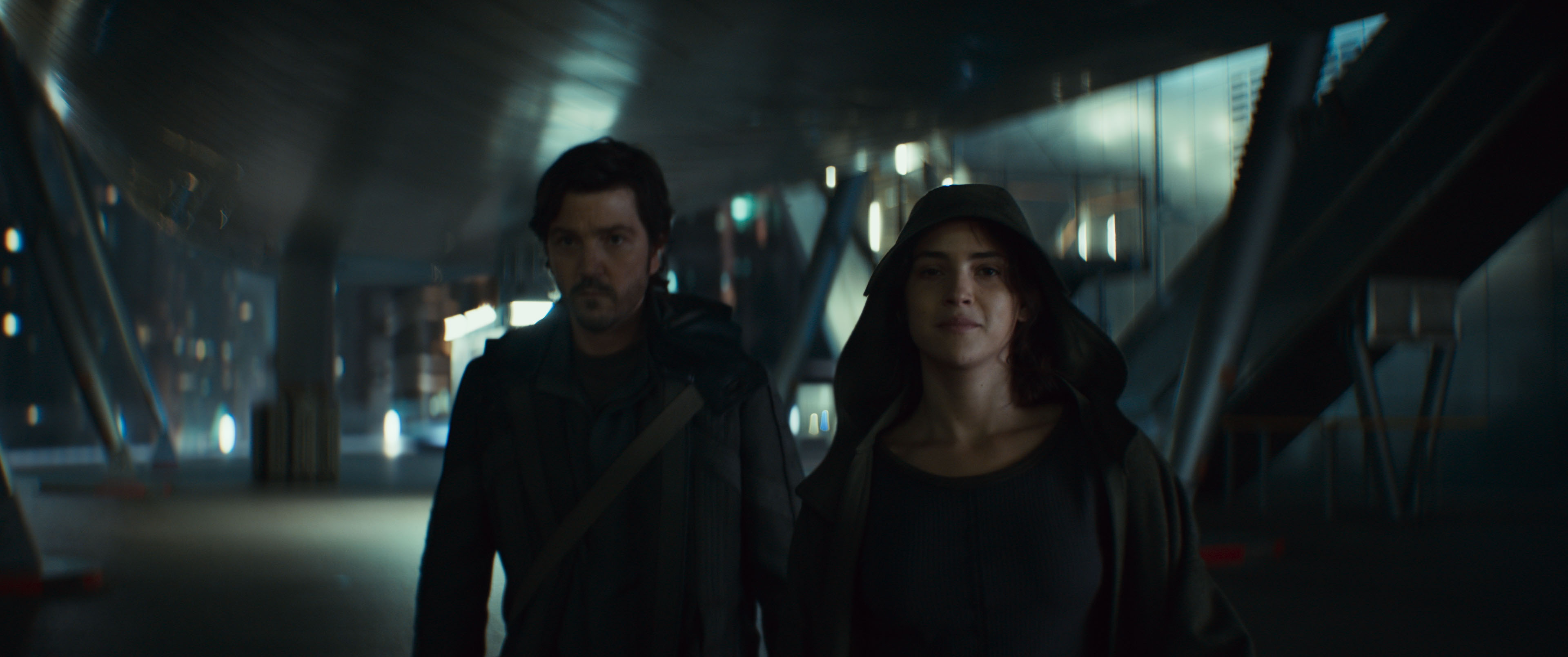 Cassian Andor (Diego Luna) and Bix Caleen (Adria Arjona), looking grimly determined, walk toward the camera in Andor season 2 Cassian Andor (Diego Luna) and Bix Caleen (Adria Arjona), looking grimly determined, walk toward the camera in Andor season 2