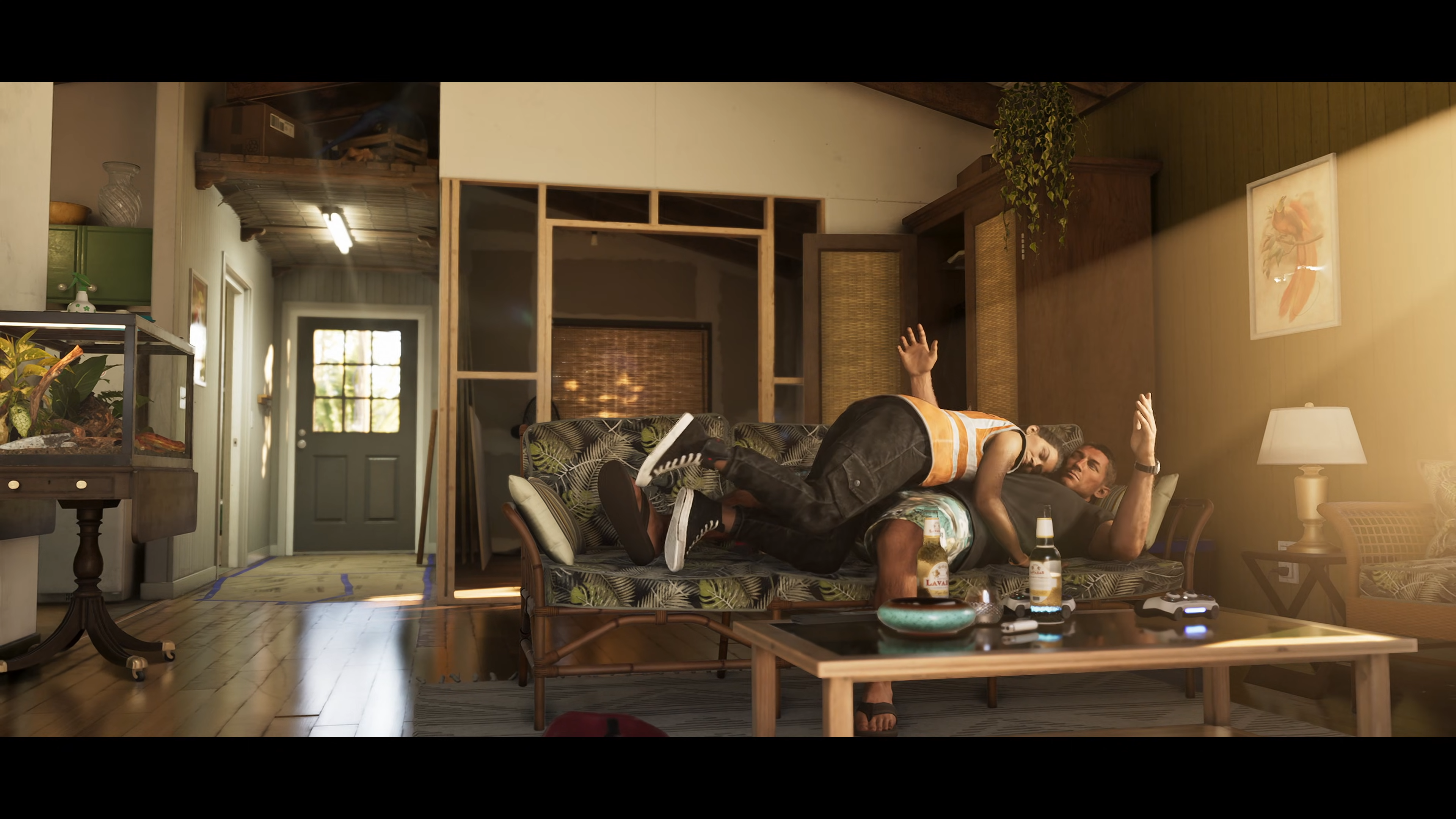 Lucia, wearing her community service vest, lying on top of Jason on the couch in Grand Theft Auto 6.