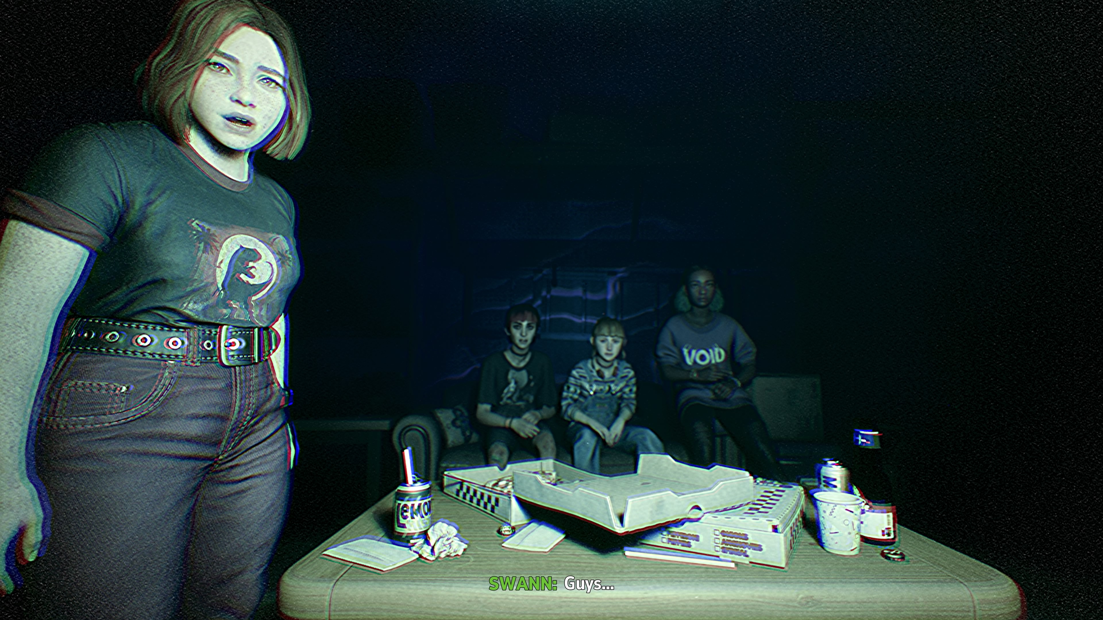 A screenshot from Lost Records: Bloom & Rage that looks like a still from a VHS tape, complete with fuzzy artifacting. It depicts four teen girls, one standing near the camera and the other three sitting behind her on a couch A screenshot from Lost Records: Bloom & Rage that looks like a still from a VHS tape, complete with fuzzy artifacting. It depicts four teen girls, one standing near the camera and the other three sitting behind her on a couch