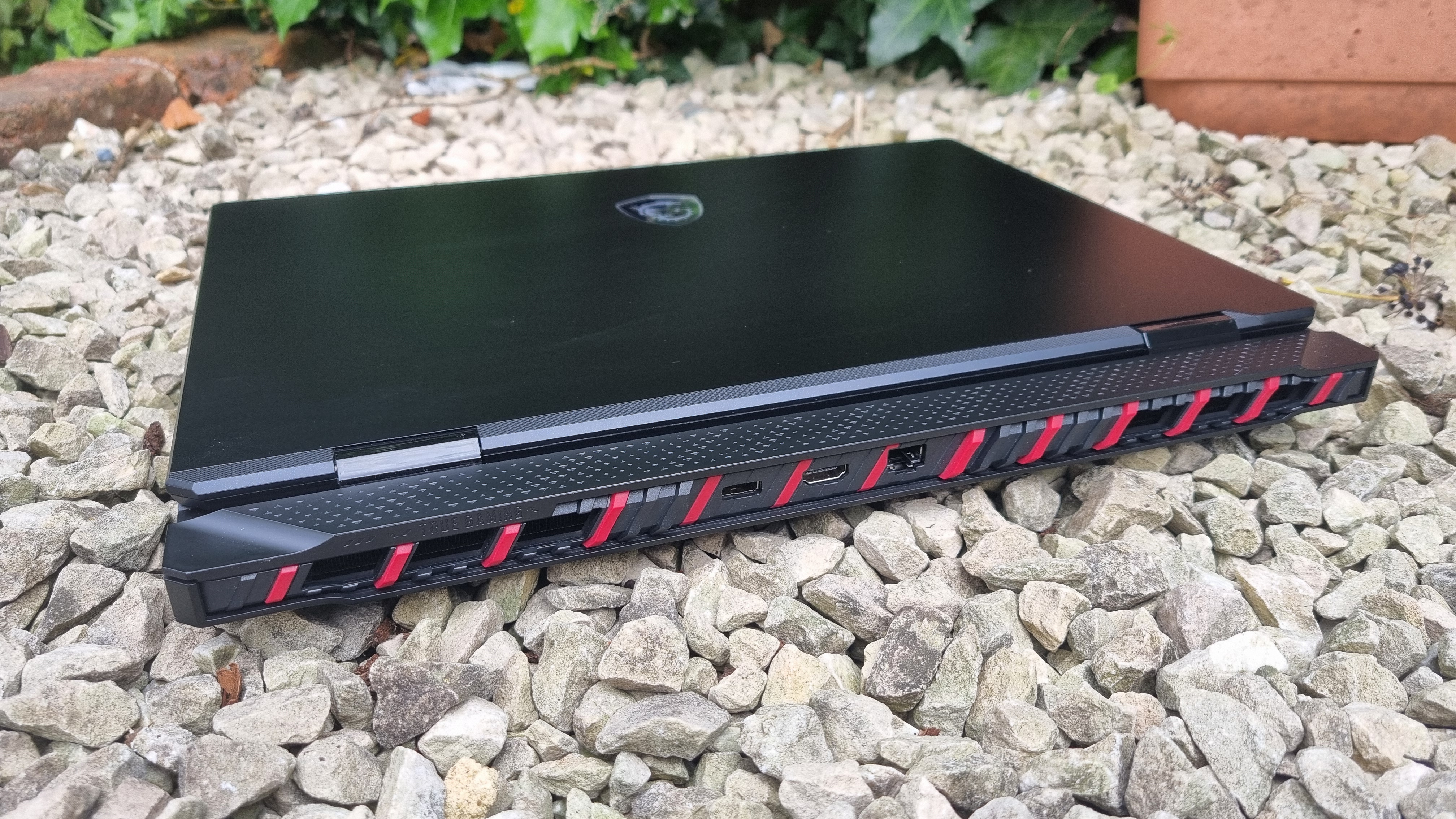 The rear of the MSI Raider 18 HX AI A2XW, showing the rear venting and the power socket