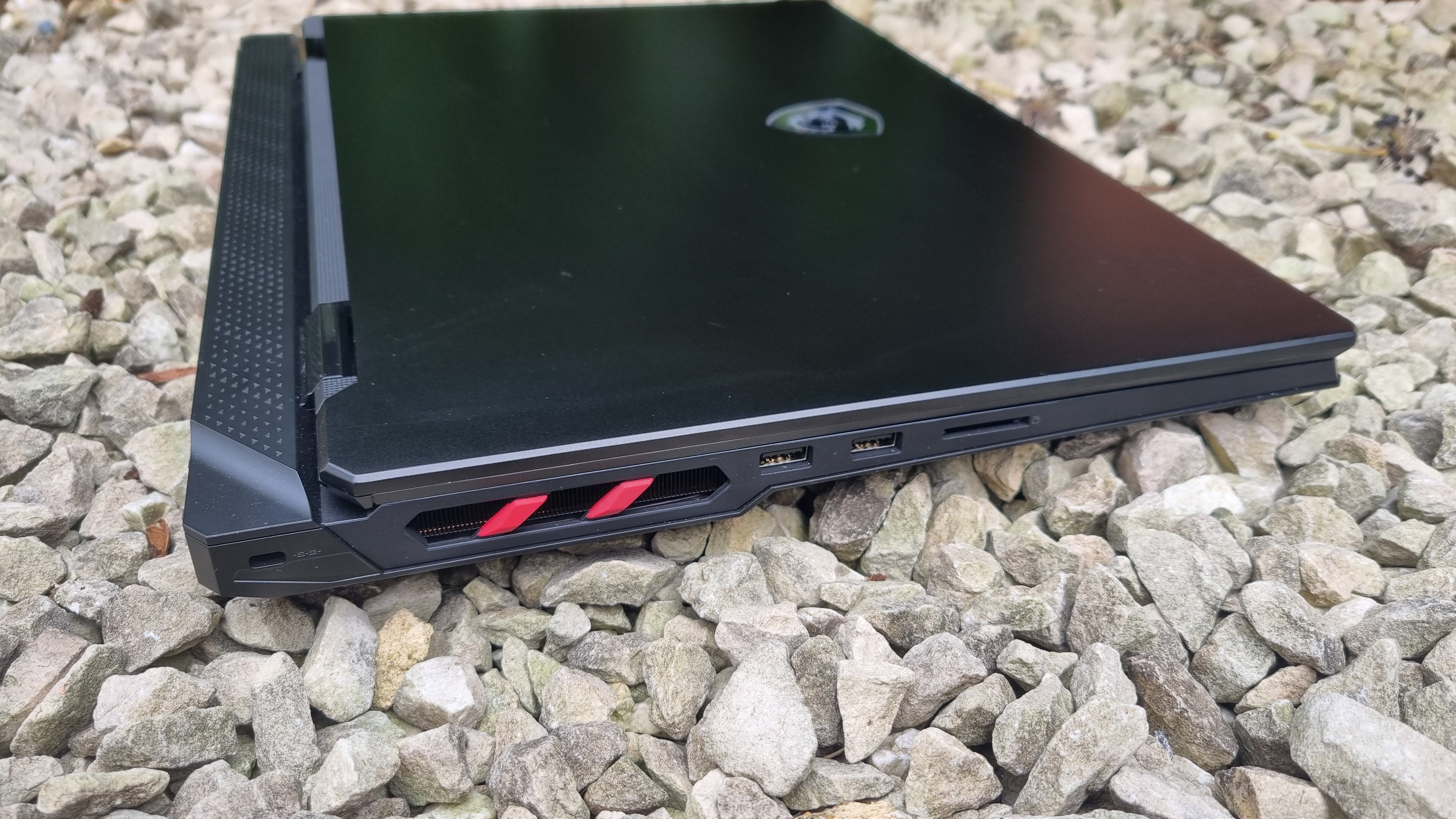 The left side of the MSI Raider 18 HX AI A2XW, showing various ports, the thickness of the laptop overall, and the substantial rear lip