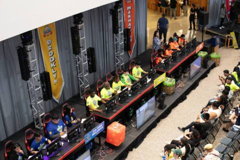 An overhead photograph of esports competitors on computers
