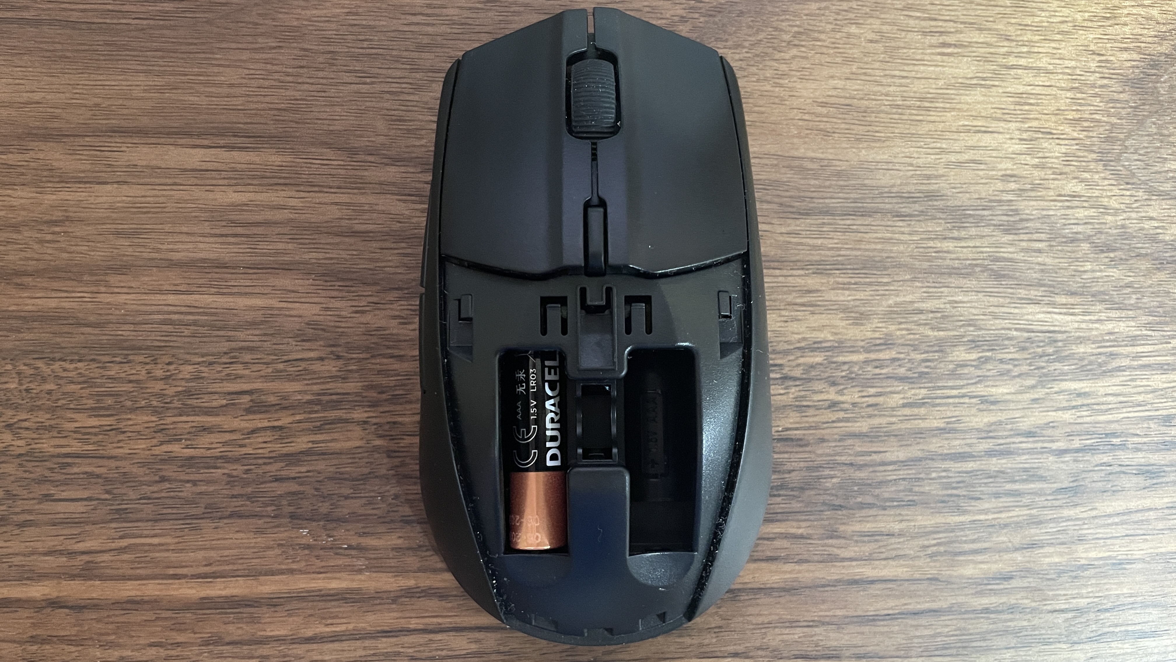 SteelSeries Rival 3 Gen 2 Wireless gaming mouse with top open and battery inside