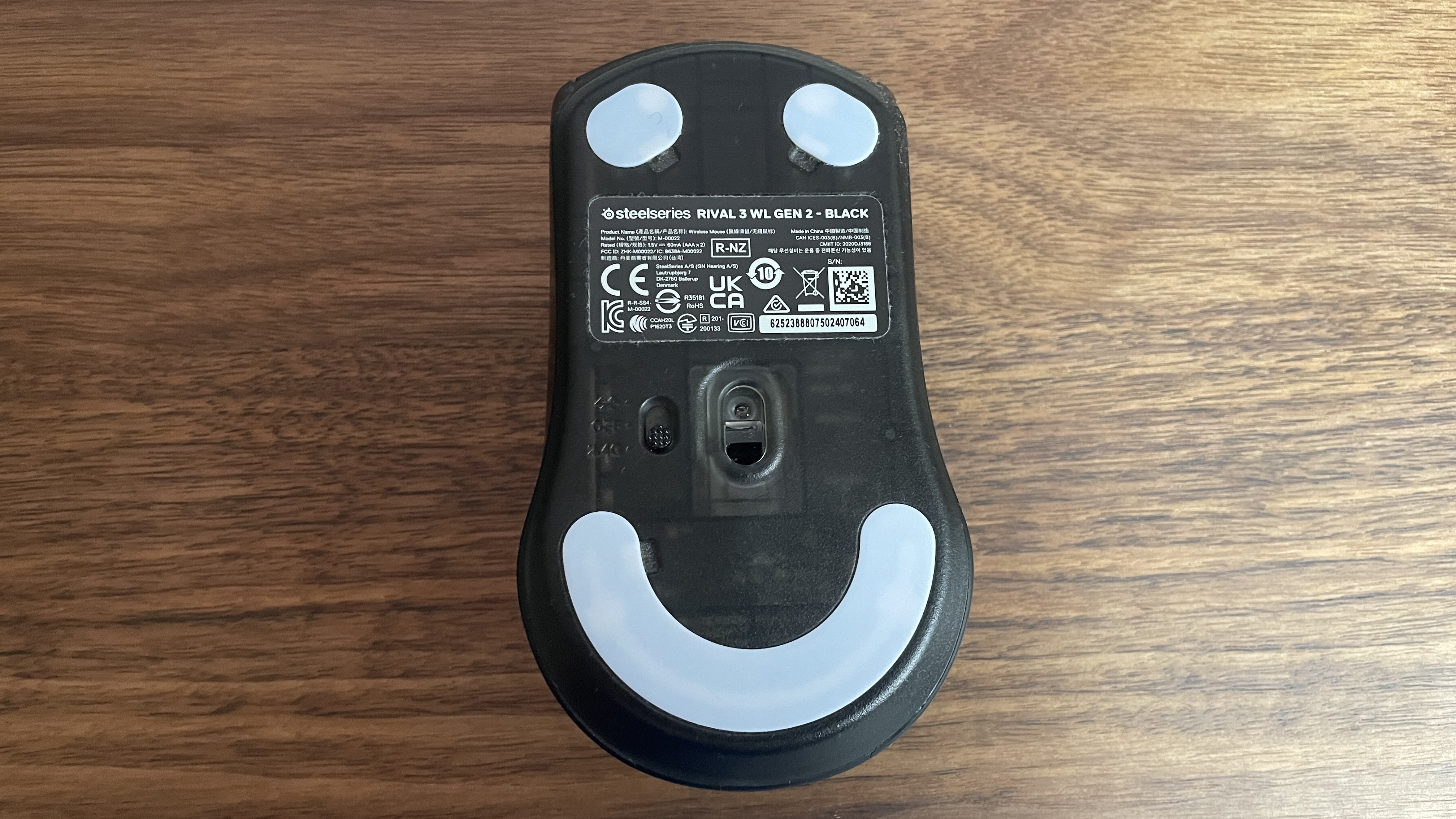 SteelSeries Rival 3 Gen 2 Wireless gaming mouse upside down showing its soft little belly
