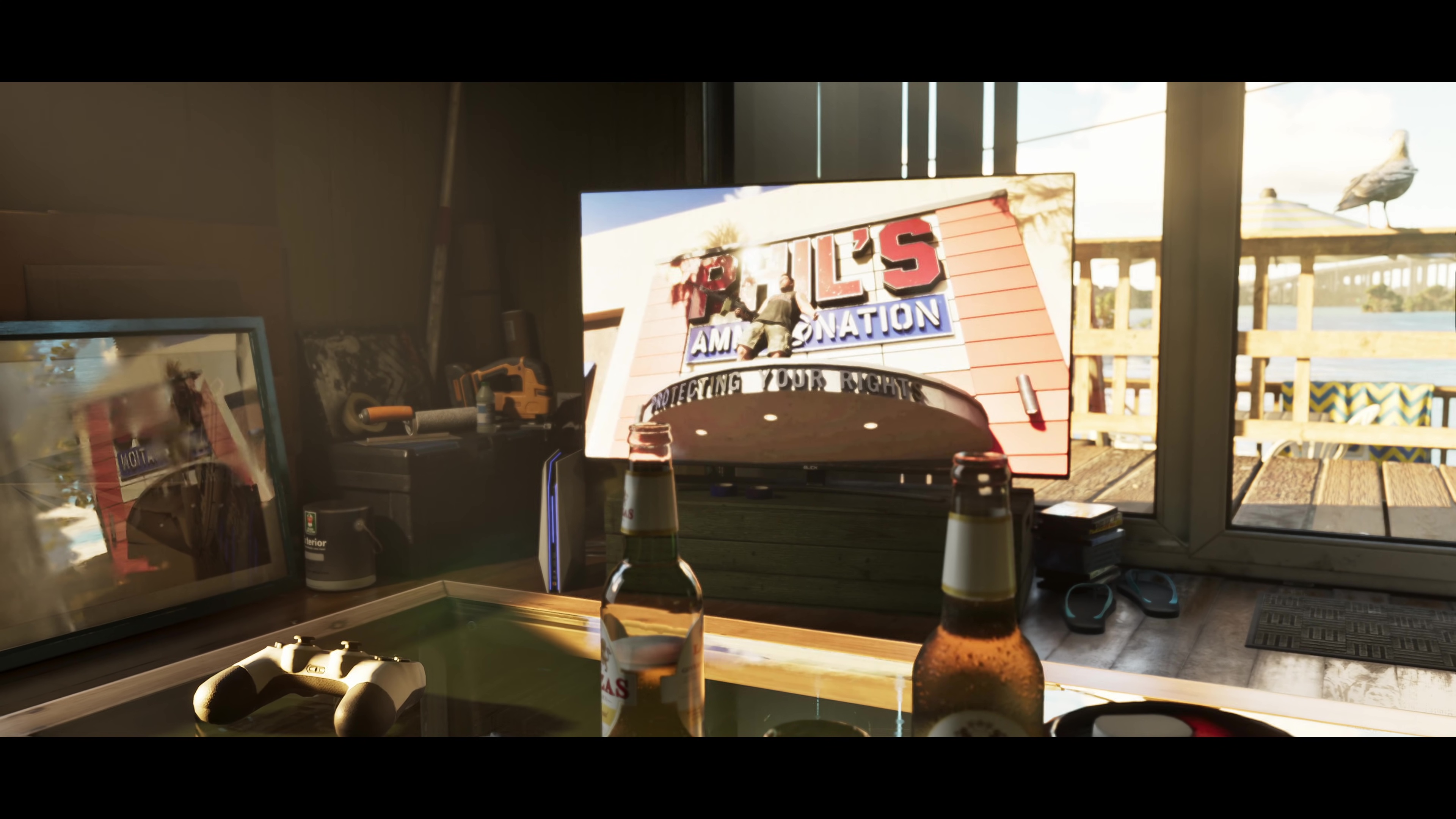 A screenshot from the second GTA 6 trailer depicting a TV in an apartment. The TV is playing an ad for a store called Phil’s Ammu-Nation. A man in the ad is standing on the roof of the store and shooting a rifle into the air A screenshot from the second GTA 6 trailer depicting a TV in an apartment. The TV is playing an ad for a store called Phil’s Ammu-Nation. A man in the ad is standing on the roof of the store and shooting a rifle into the air