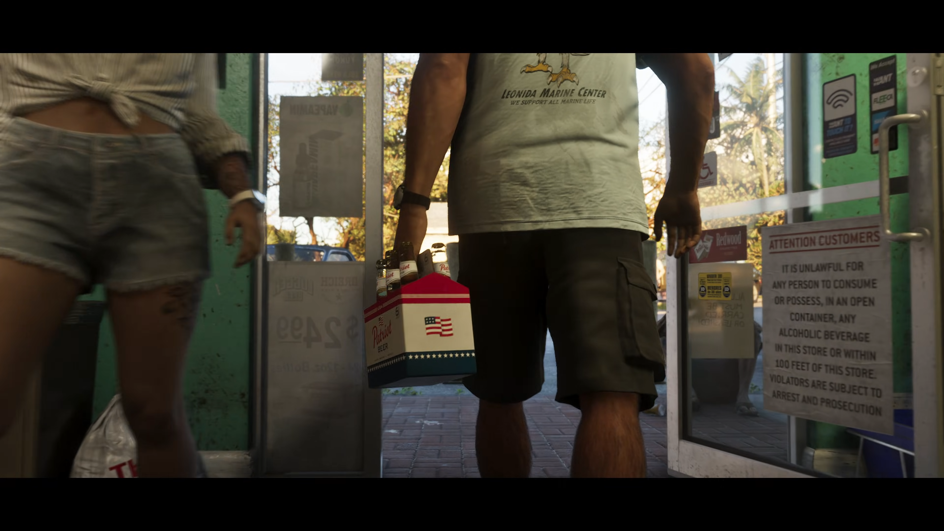 Jason leaves a convenience store in GTA 6. On the right, the store's front door shows a series of bespoke fictional logos and branding.