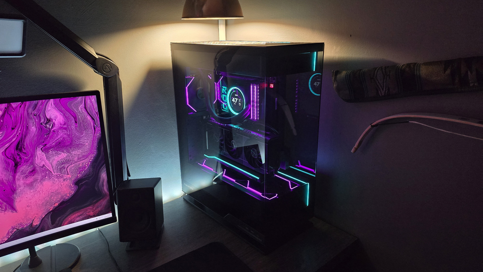 A gaming PC lit up with neon-style lighting and using an RX 9070 XT graphics card.