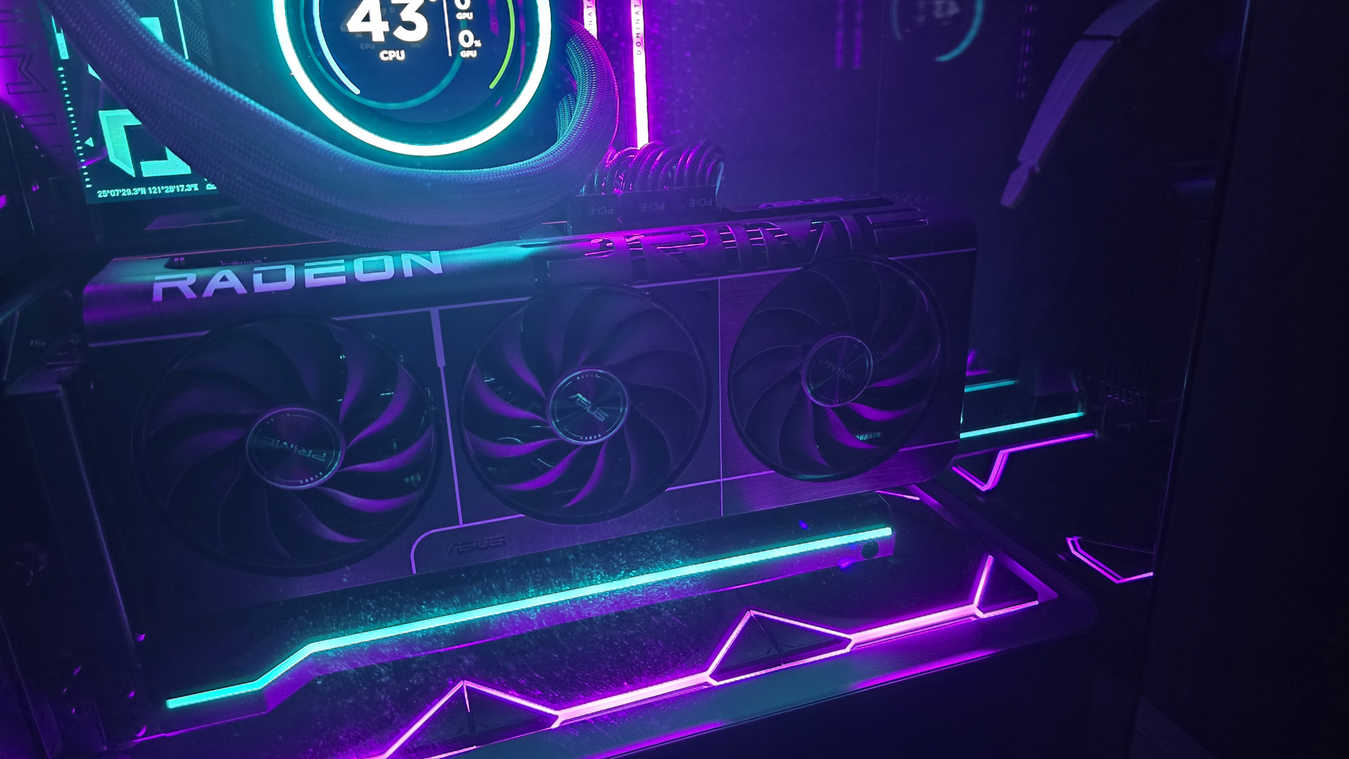 A gaming PC lit up with neon-style lighting and using an RX 9070 XT graphics card.