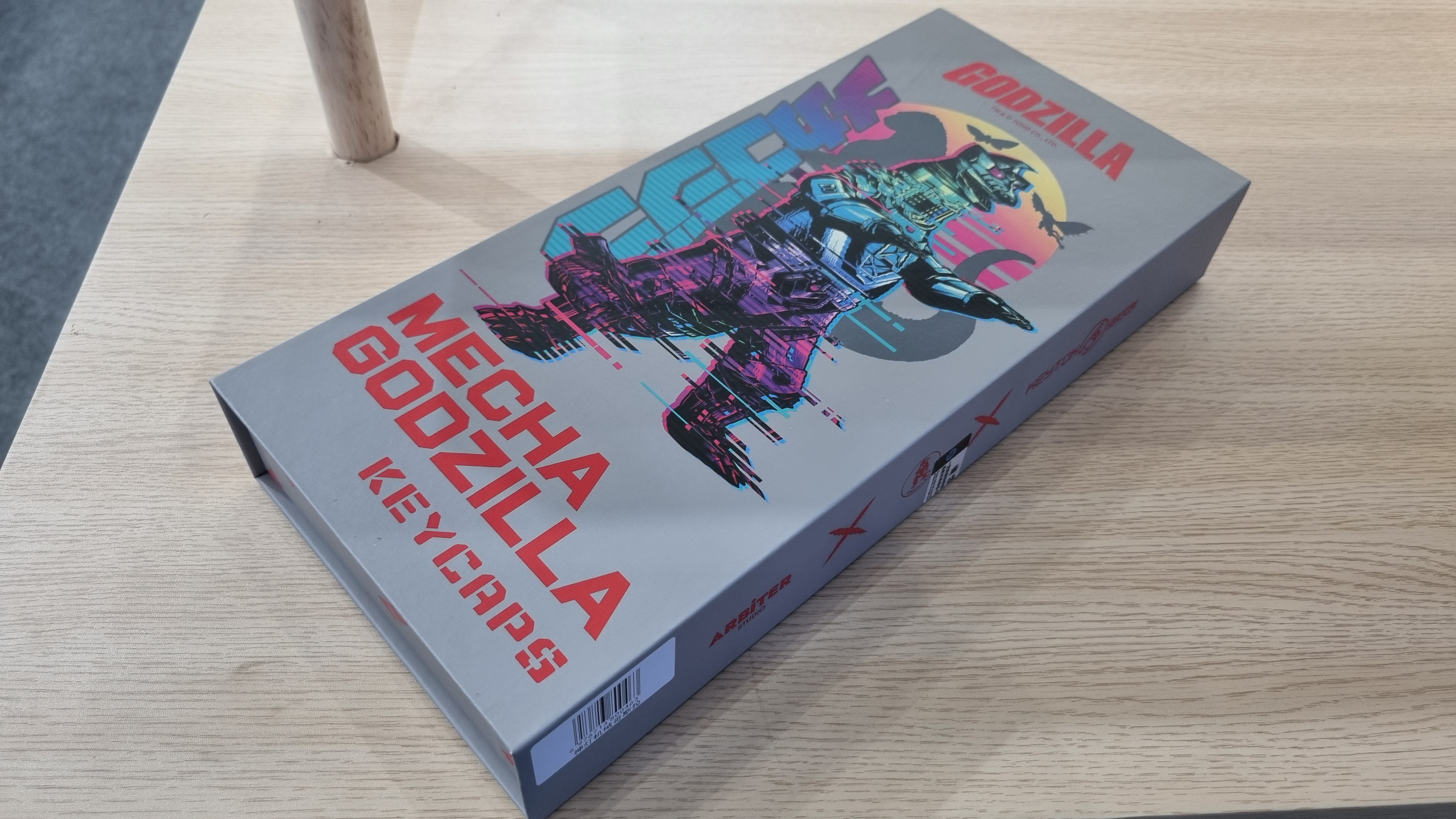 Various custom Godzilla keycaps and boxes at the KeyTok booth, 2025